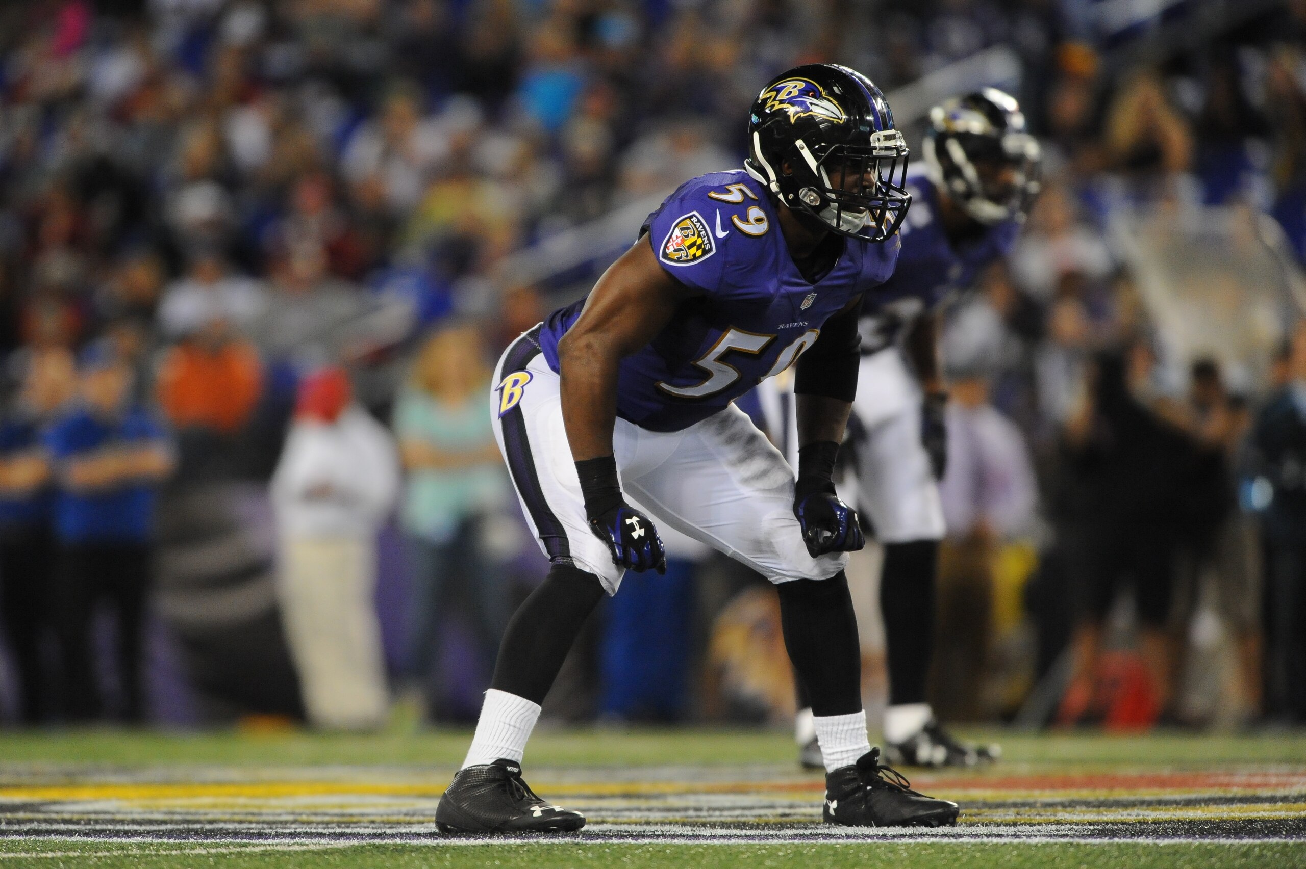 BALTIMORE, MD - AUGUST 23:  Inside linebacker Arthur Brown #59 of the Baltimore Ravens defends during a preseason game against the Washington Redskins at M&T Bank Stadium on August 23, 2014 in Baltimore, Maryland.  (Photo by Larry French/Getty Images)