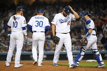 LOS ANGELES, CALIFORNIA - OCTOBER 09: Clayton Kershaw #22 of the Los Angeles Dodgers leaves the game after giving up back to back home runs in the eighth inning of game five of the National League Division Series against the Washington Nationals at Dodger