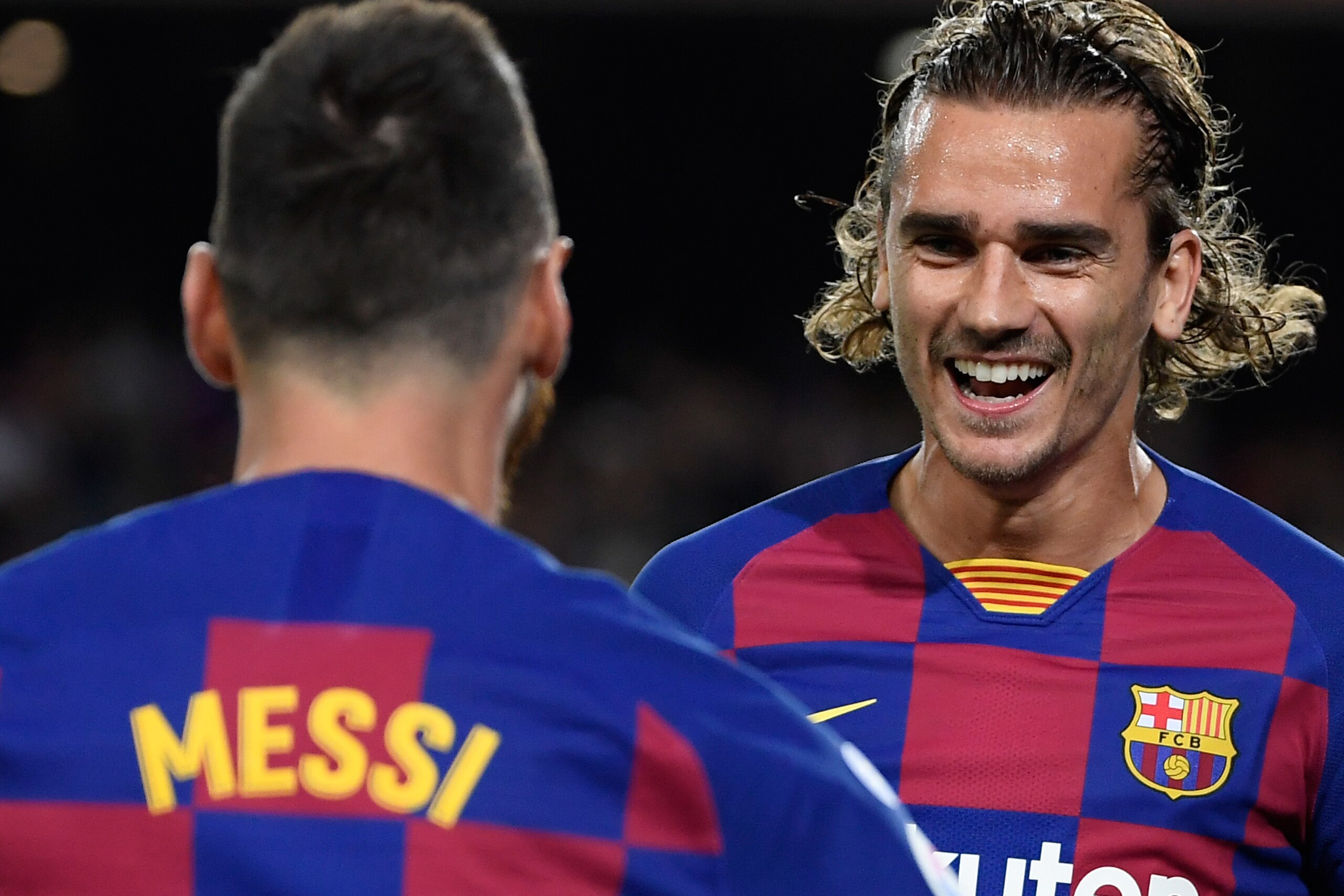 TOPSHOT - Barcelona's French forward Antoine Griezmann (R) is congratulated by teammate Barcelona's Argentine forward Lionel Messi after scoring the first goal during the Spanish league football match between FC Barcelona and Villarreal CF at the Camp Nou TOPSHOT - Barcelona's French forward Antoine Griezmann (R) is congratulated by teammate Barcelona's Argentine forward Lionel Messi after scoring the first goal during the Spanish league football match between FC Barcelona and Villarreal CF at the Camp Nou