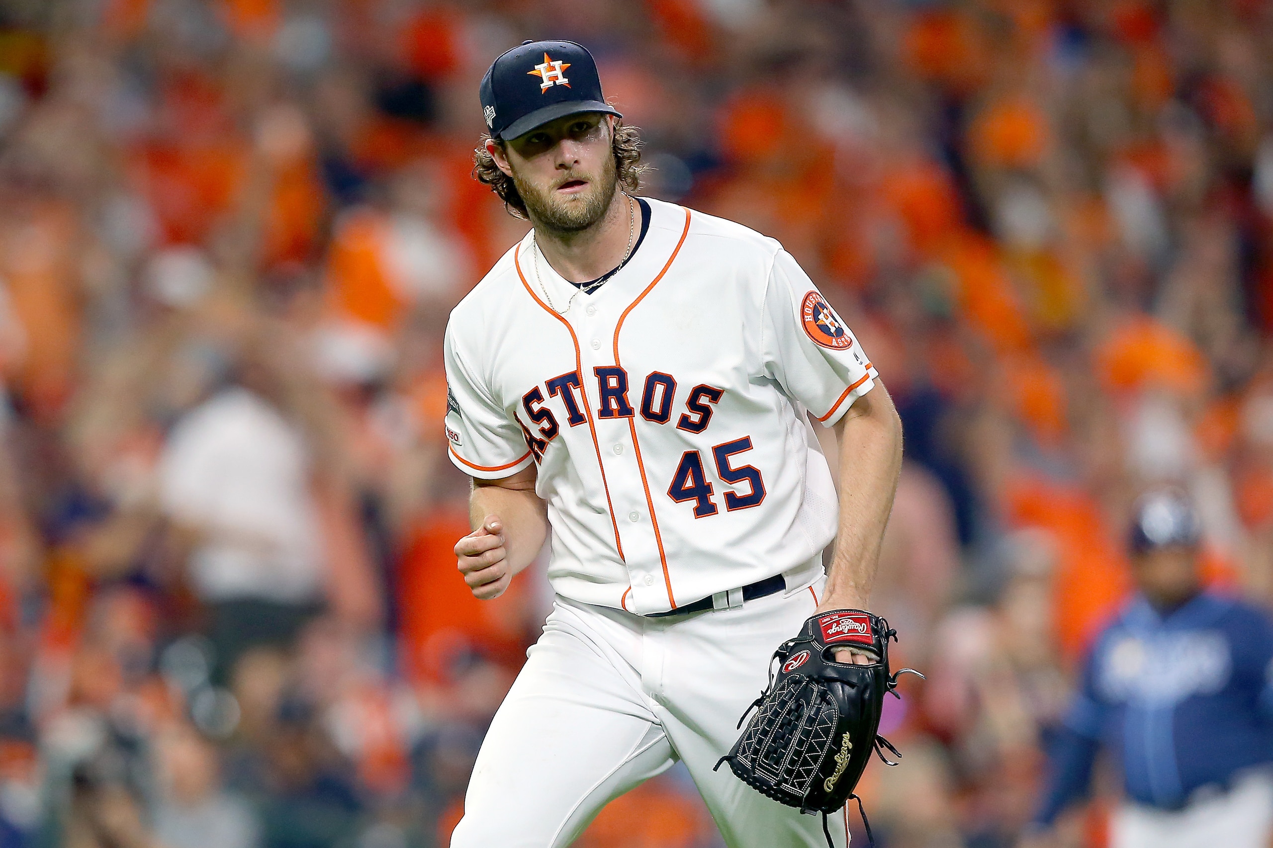 HOUSTON, TEXAS - OCTOBER 10:  Gerrit Cole #45 of the Houston Astros reacts after striking out Willy Adames (not pictured) #1 of the Tampa Bay Rays during the fifth inning in game five of the American League Division Series at Minute Maid Park on October 1