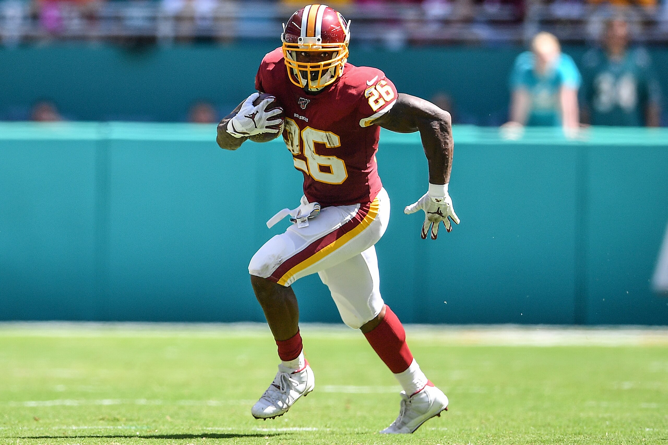 MIAMI, FLORIDA - OCTOBER 13 Adrian Peterson #26 of the Washington Redskins runs with the ball against the Miami Dolphins in the second quarter at Hard Rock Stadium on October 13, 2019 in Miami, Florida. (Photo by Mark Brown/Getty Images) MIAMI, FLORIDA - OCTOBER 13 Adrian Peterson #26 of the Washington Redskins runs with the ball against the Miami Dolphins in the second quarter at Hard Rock Stadium on October 13, 2019 in Miami, Florida. (Photo by Mark Brown/Getty Images)