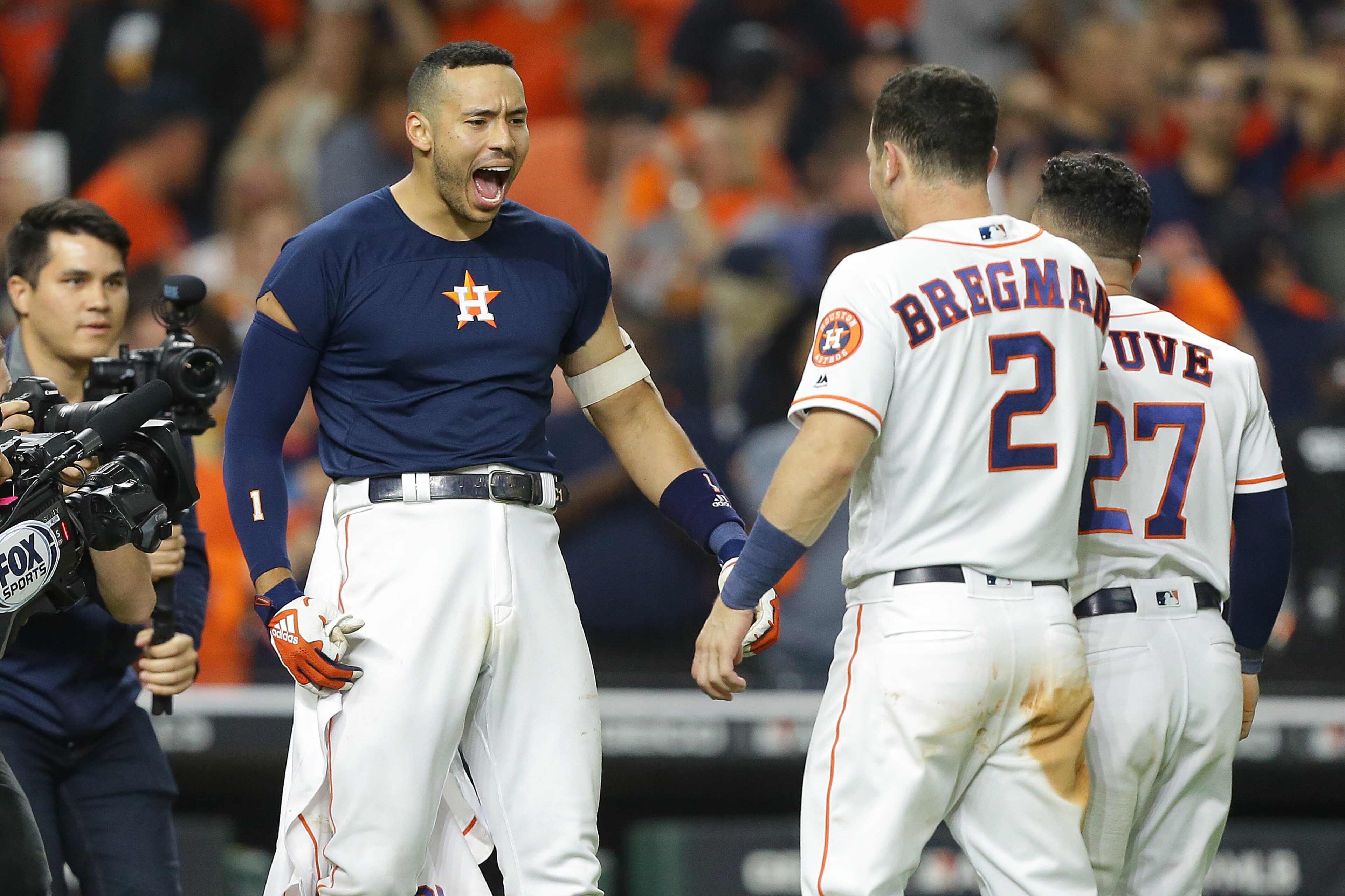 HOUSTON, TEXAS - OCTOBER 13: Carlos Correa #1 of the Houston Astros celebrates hitting a walk-off solo home run during the eleventh inning against the New York Yankees to win game two of the American League Championship Series 3-2 at Minute Maid Park on O