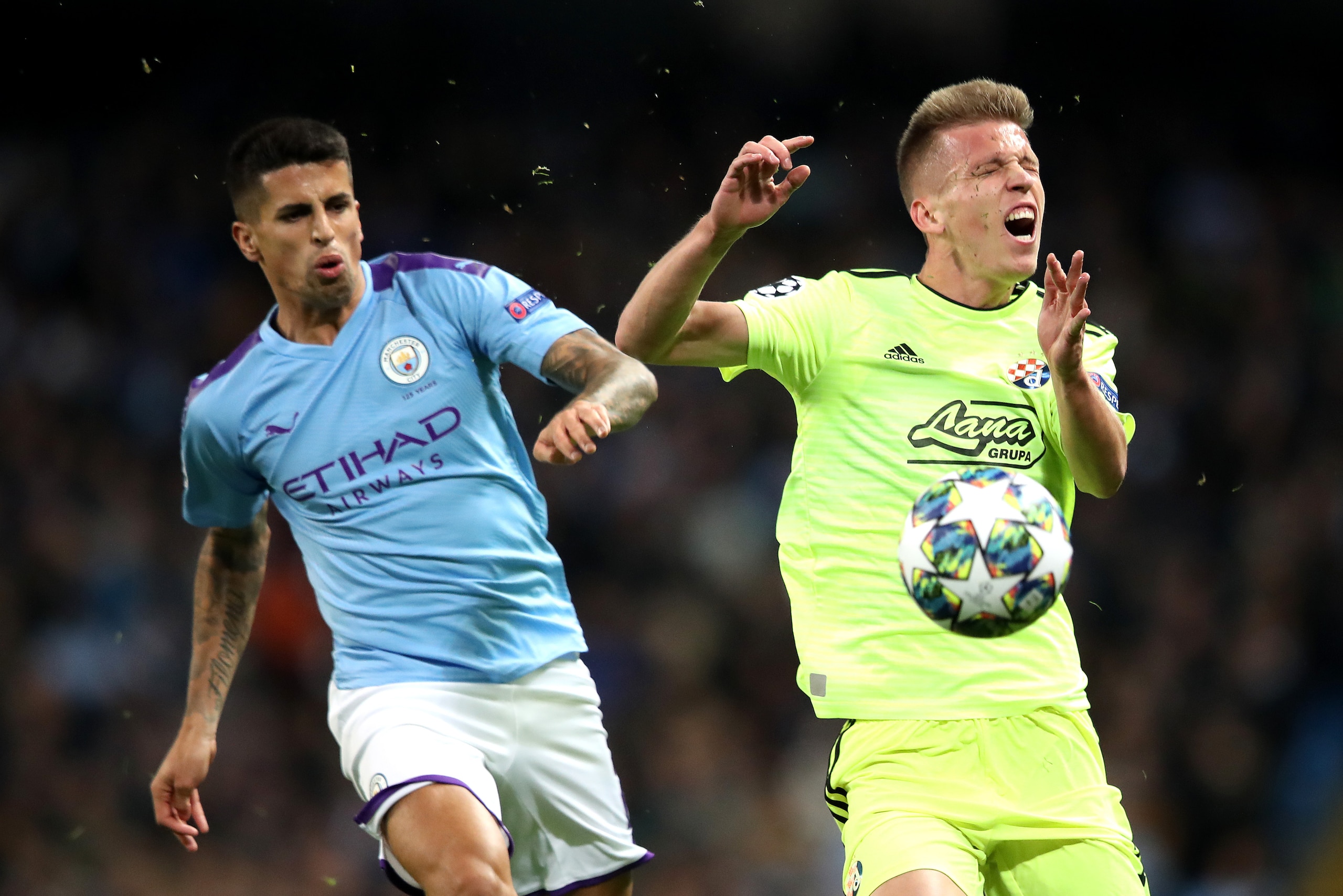MANCHESTER, ENGLAND - OCTOBER 01:  Dani Olmo of GNK Dinamo Zagreb reacts to a tackle from Joao Cancelo of Manchester City during the UEFA Champions League group C match between Manchester City and Dinamo Zagreb at Etihad Stadium on October 01, 2019 in Man