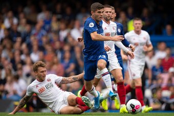 LONDON, ENGLAND - AUGUST 31: Luke Freeman of Sheffield United tackles Christian Pulisic of Chelsea during the Premier League match between Chelsea FC and Sheffield United at Stamford Bridge on August 31, 2019 in London, United Kingdom. (Photo by Visionhau