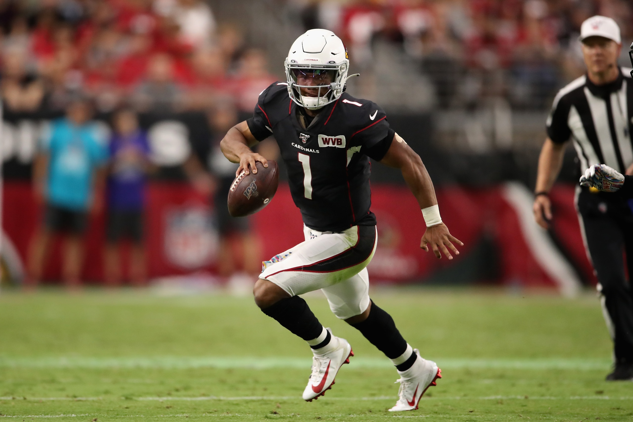 GLENDALE, ARIZONA - OCTOBER 13:  Quarterback Kyler Murray #1 of the Arizona Cardinals scrambles with the football during the NFL game against the Atlanta Falcons at State Farm Stadium on October 13, 2019 in Glendale, Arizona. The Cardinals defeated the Fa