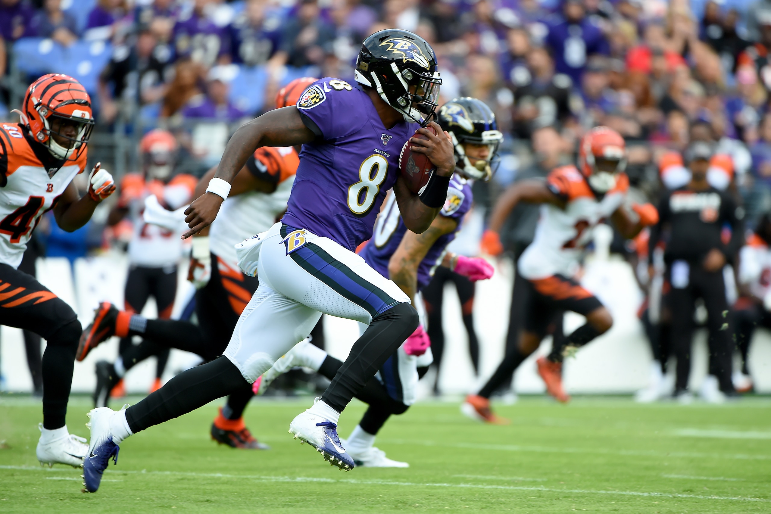 BALTIMORE, MD - OCTOBER 13: Lamar Jackson #8 of the Baltimore Ravens runs against the Cincinnati Bengals during the first half at M&T Bank Stadium on October 13, 2019 in Baltimore, Maryland. (Photo by Will Newton/Getty Images)