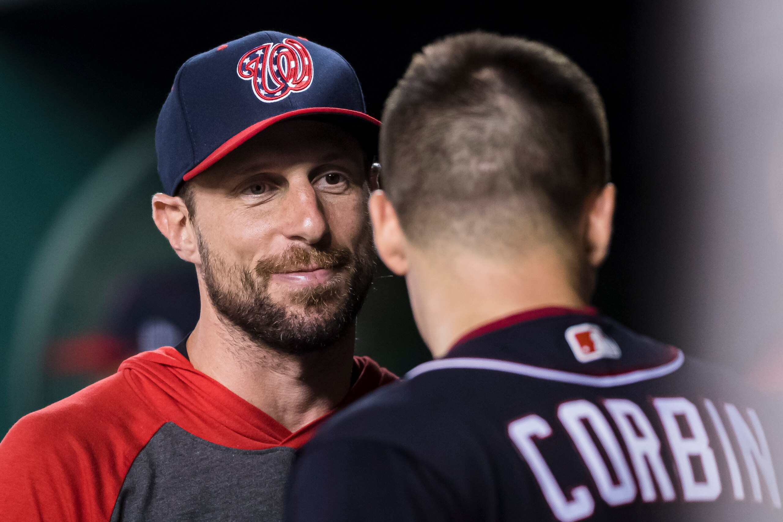 WASHINGTON, DC - AUGUST 16: Max Scherzer #31 of the Washington Nationals speaks with Patrick Corbin #46 in the dugout during the sixth inning against the Milwaukee Brewers at Nationals Park on August 16, 2019 in Washington, DC. (Photo by Scott Taetsch/Get
