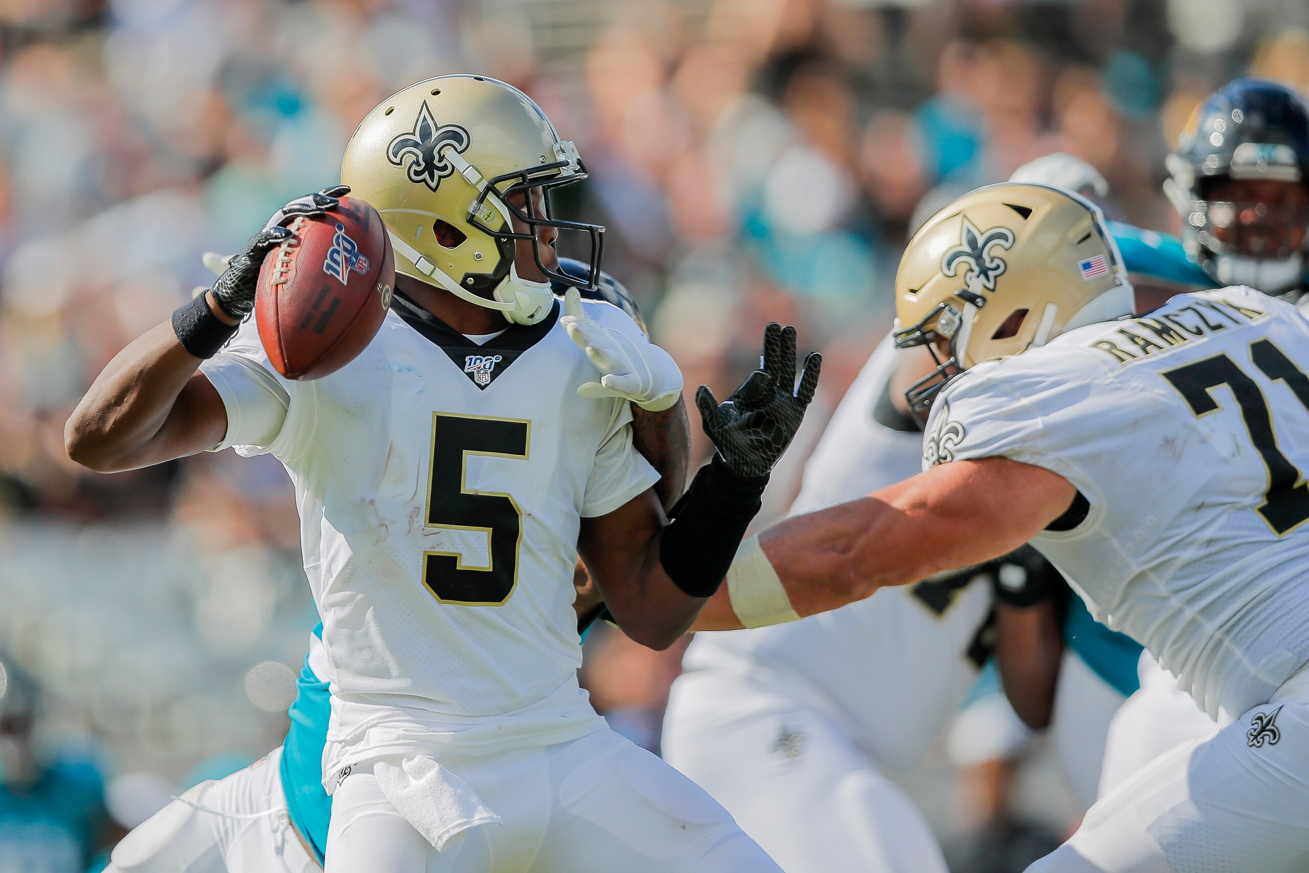 JACKSONVILLE, FLORIDA - OCTOBER 13: Teddy Bridgewater #5 of the New Orleans Saints is pressured by Yannick Ngakoue #91 of the Jacksonville Jaguars during the third quarter of a game at TIAA Bank Field on October 13, 2019 in Jacksonville, Florida. (Photo b