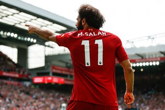 LIVERPOOL, ENGLAND - SEPTEMBER 14: Mohamed Salah of Liverpool celebrates after scoring his side's third goal to make the score 3-1 during the Premier League match between Liverpool FC and Newcastle United at Anfield on September 14, 2019 in Liverpool, Uni