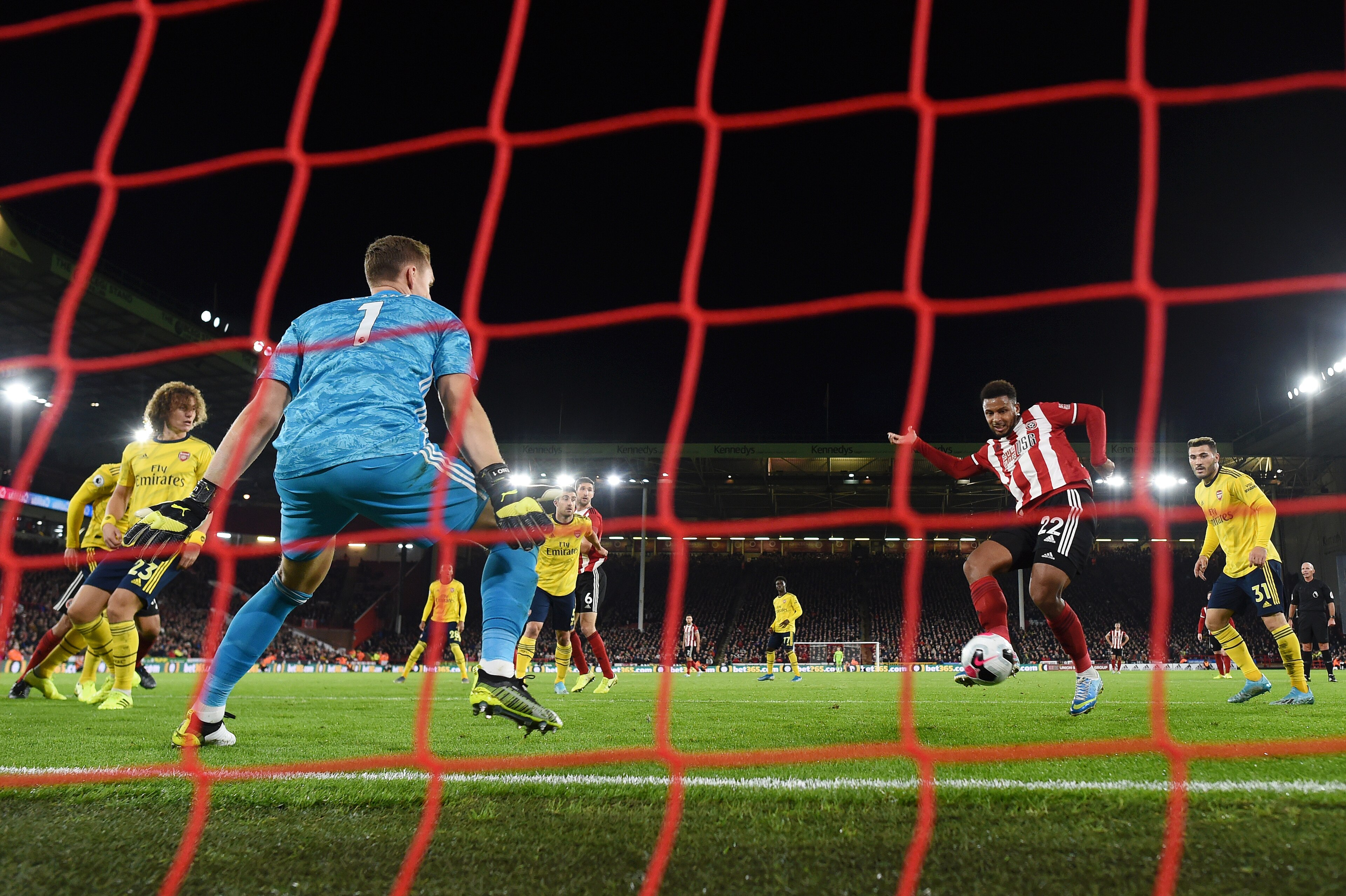 SHEFFIELD, ENGLAND - OCTOBER 21:   Lys Mousset of Sheffield United scores his sides 1st goal during the Premier League match between Sheffield United and Arsenal FC at Bramall Lane on October 21, 2019 in Sheffield, United Kingdom. (Photo by Michael Regan/