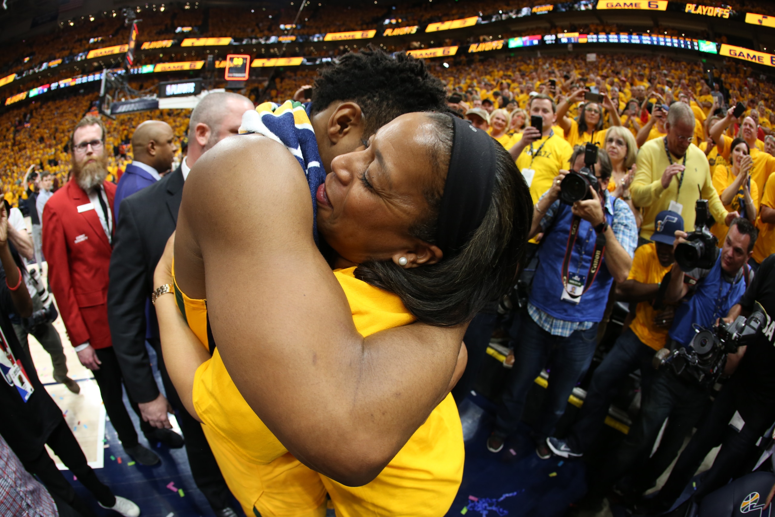 SALT LAKE CITY, UT - APRIL 27: Donovan Mitchell #45 of the Utah Jazz hugs his mother Nicole Mitchell after Game Six of the Western Conference Quarterfinals during the 2018 NBA Playoffs against the Oklahoma City Thunder on April 27, 2018 at vivint.SmartHo SALT LAKE CITY, UT - APRIL 27: Donovan Mitchell #45 of the Utah Jazz hugs his mother Nicole Mitchell after Game Six of the Western Conference Quarterfinals during the 2018 NBA Playoffs against the Oklahoma City Thunder on April 27, 2018 at vivint.SmartHo