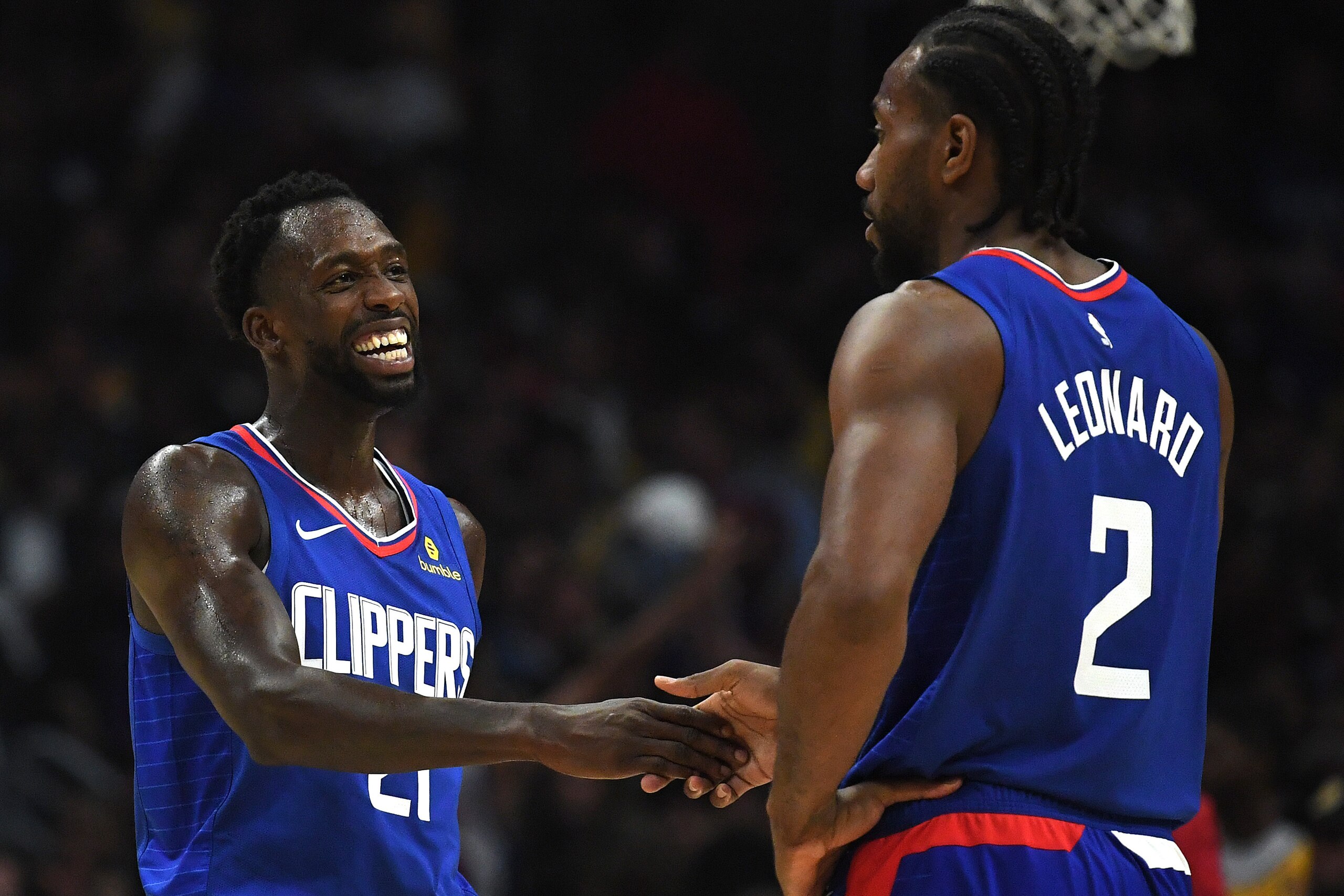 LOS ANGELES, CALIFORNIA - OCTOBER 22: Patrick Beverley #21 of the LA Clippers laughs with Kawhi Leonard #2 leading the Los Angeles Lakers during the fourth quarter in a 112-102 Clippers win in the LA Clippers season home opener at Staples Center on Octo LOS ANGELES, CALIFORNIA - OCTOBER 22: Patrick Beverley #21 of the LA Clippers laughs with Kawhi Leonard #2 leading the Los Angeles Lakers during the fourth quarter in a 112-102 Clippers win in the LA Clippers season home opener at Staples Center on Octo
