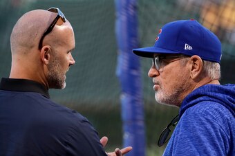 CHICAGO, IL - OCTOBER 18:  Former Chicago Cubs player David Ross meets with manager Joe Maddon of the Chicago Cubs before game four of the National League Championship Series against the Los Angeles Dodgers at Wrigley Field on October 18, 2017 in Chicago,
