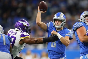 DETROIT, MICHIGAN - OCTOBER 20: Matthew Stafford #9 of the Detroit Lions tries to get a first half pass off around Danielle Hunter #99 of the Minnesota Vikings at Ford Field on October 20, 2019 in Detroit, Michigan. (Photo by Gregory Shamus/Getty Images)