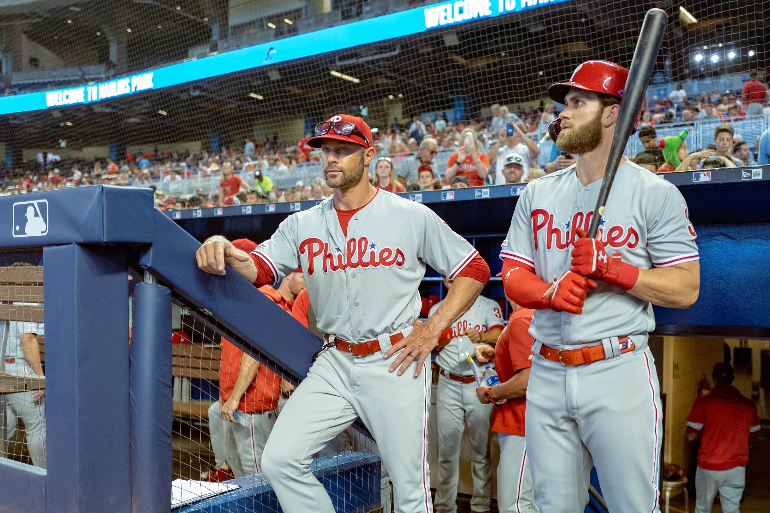 MIAMI, FL - APRIL 14: Bryce Harper #3 of the Philadelphia Phillies stands in the dugout with Gabe Kapler #19 before the game against the Miami Marlins at Marlins Park on April 14, 2019 in Miami, Florida. (Photo by Mark Brown/Getty Images)