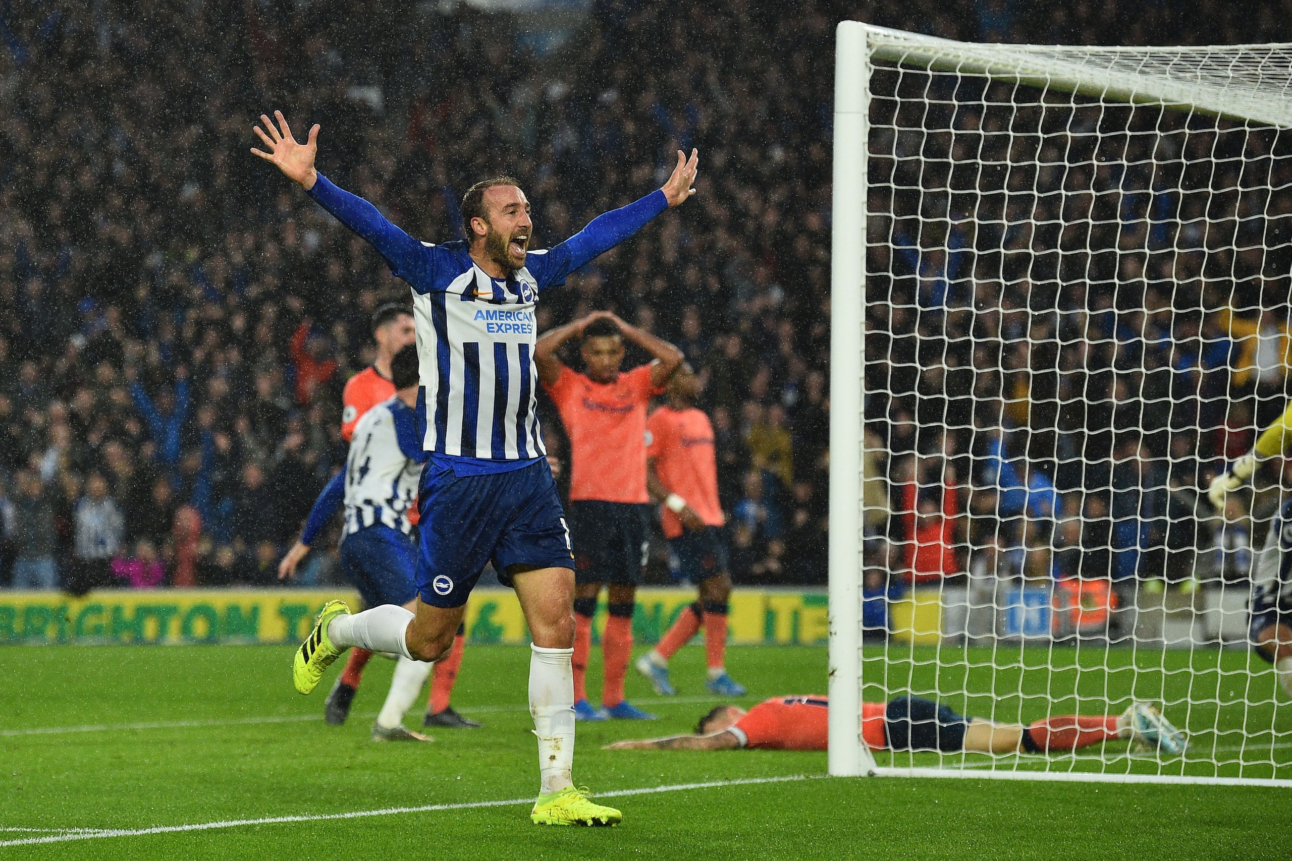 Brighton's English striker Glenn Murray (L) celebrates an own goal scored by Everton's French defender Lucas Digne for Brighton's third goal to take the lead 3-2 during the English Premier League football match between Brighton and Hove Albion and Everton