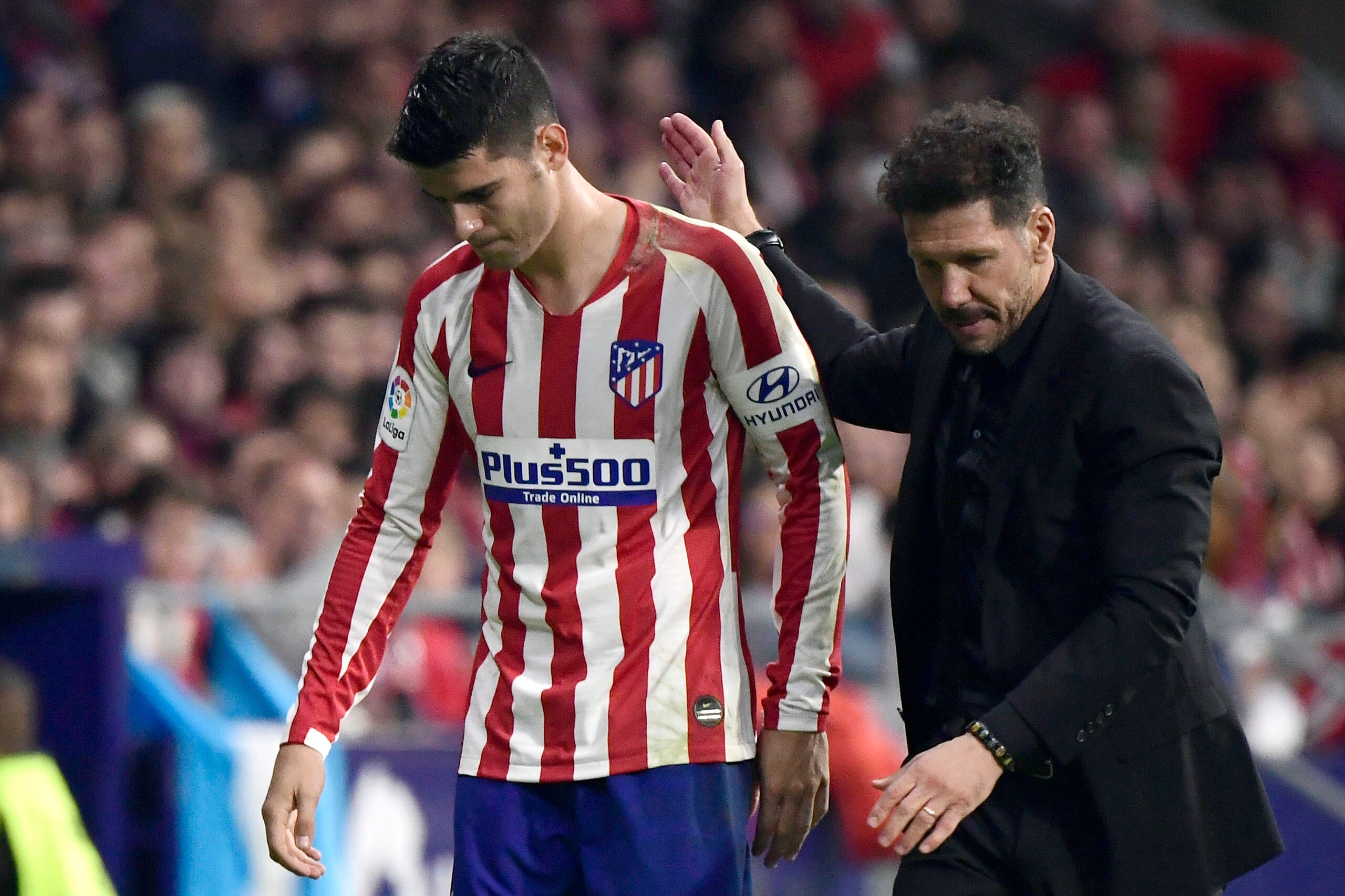 Atletico Madrid's Argentinian coach Diego Simeone congratulates Atletico Madrid's Spanish forward Alvaro Morata as he leaves the pitch during the Spanish league football match between Club Atletico de Madrid and Athletic Club Bilbao at the Wanda Metropoli