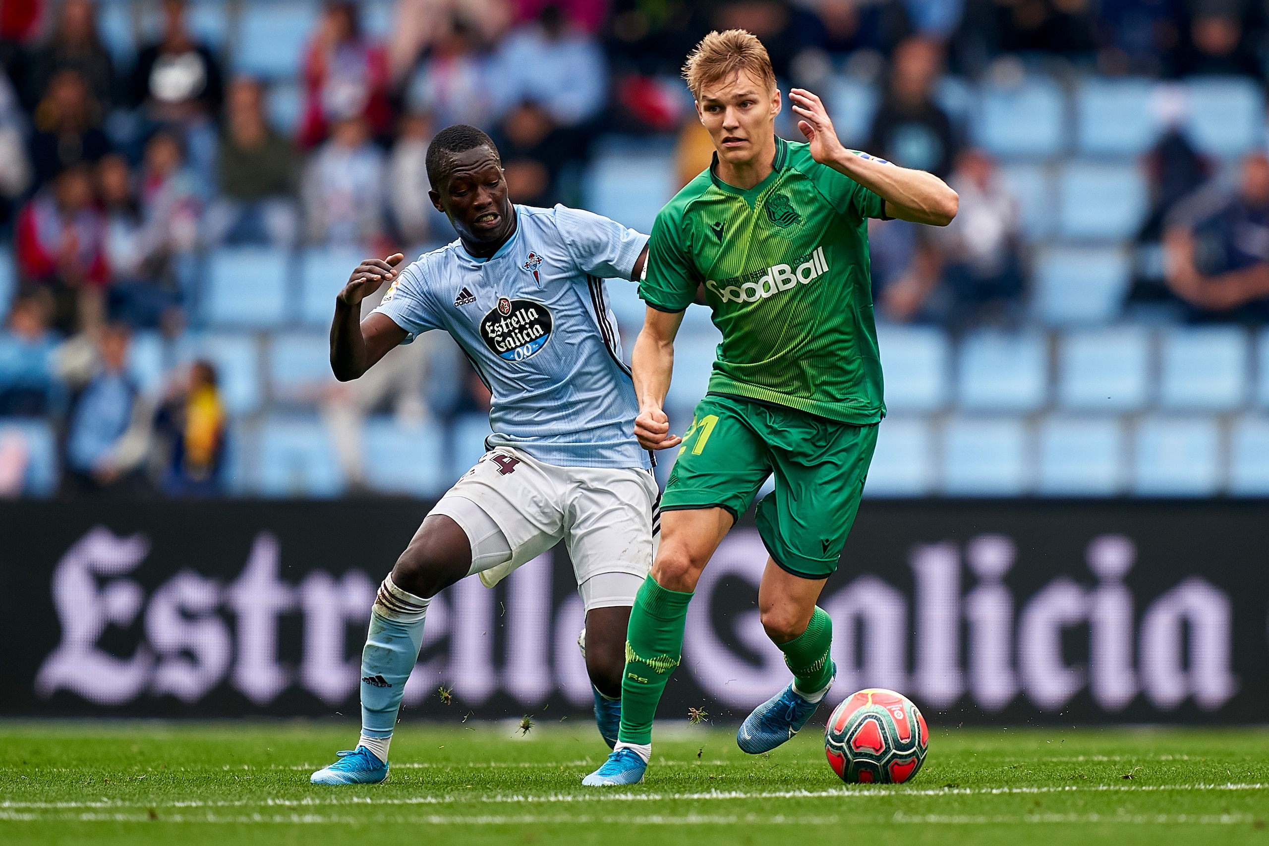 VIGO, SPAIN - OCTOBER 27: Pape Cheik of Celta de Vigo competes for the ball with Martin Odegaard of Real Sociedad during the Liga match between RC Celta de Vigo and Real Sociedad at Abanca-Balaídos on October 27, 2019 in Vigo, Spain. (Photo by Quality Spo VIGO, SPAIN - OCTOBER 27: Pape Cheik of Celta de Vigo competes for the ball with Martin Odegaard of Real Sociedad during the Liga match between RC Celta de Vigo and Real Sociedad at Abanca-Balaídos on October 27, 2019 in Vigo, Spain. (Photo by Quality Spo