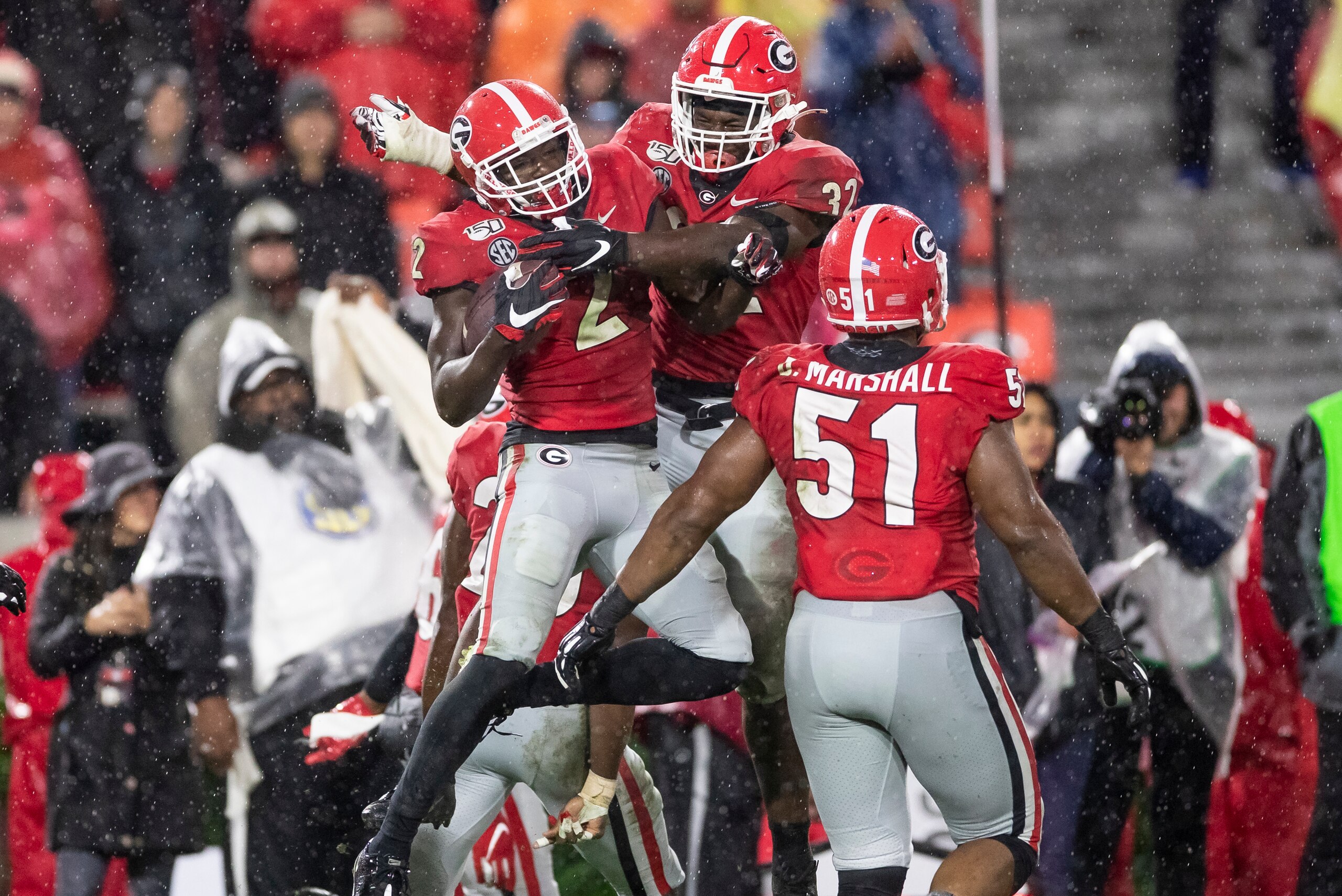 ATHENS, GA - OCTOBER 19: Richard LeCounte #2 and Monty Rice #32 of the Georgia Bulldogs celebrate LeCounte