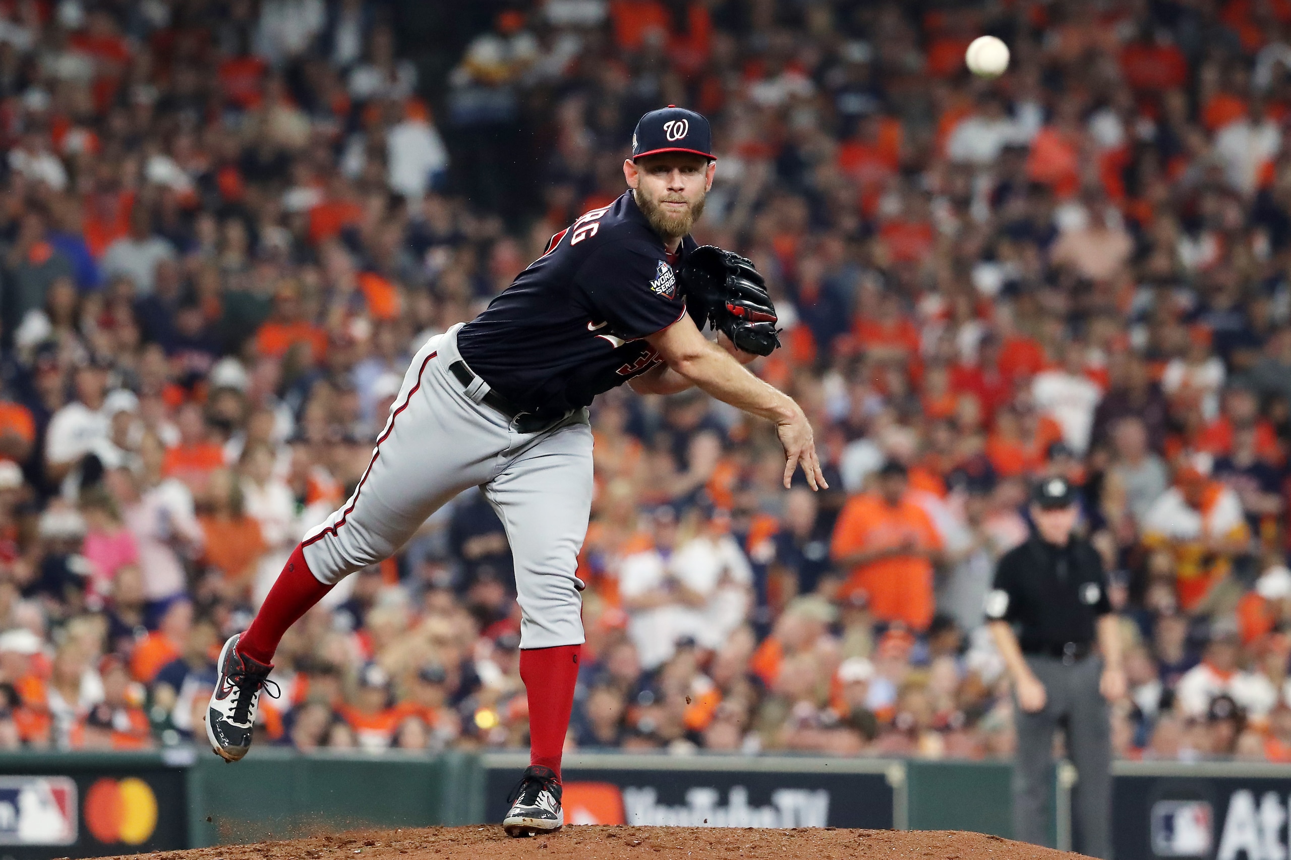 HOUSTON, TEXAS - OCTOBER 23: Stephen Strasburg #37 of the Washington Nationals attempts a pickoff against the Houston Astros during the third inning in Game Two of the 2019 World Series at Minute Maid Park on October 23, 2019 in Houston, Texas. (Photo by HOUSTON, TEXAS - OCTOBER 23: Stephen Strasburg #37 of the Washington Nationals attempts a pickoff against the Houston Astros during the third inning in Game Two of the 2019 World Series at Minute Maid Park on October 23, 2019 in Houston, Texas. (Photo by