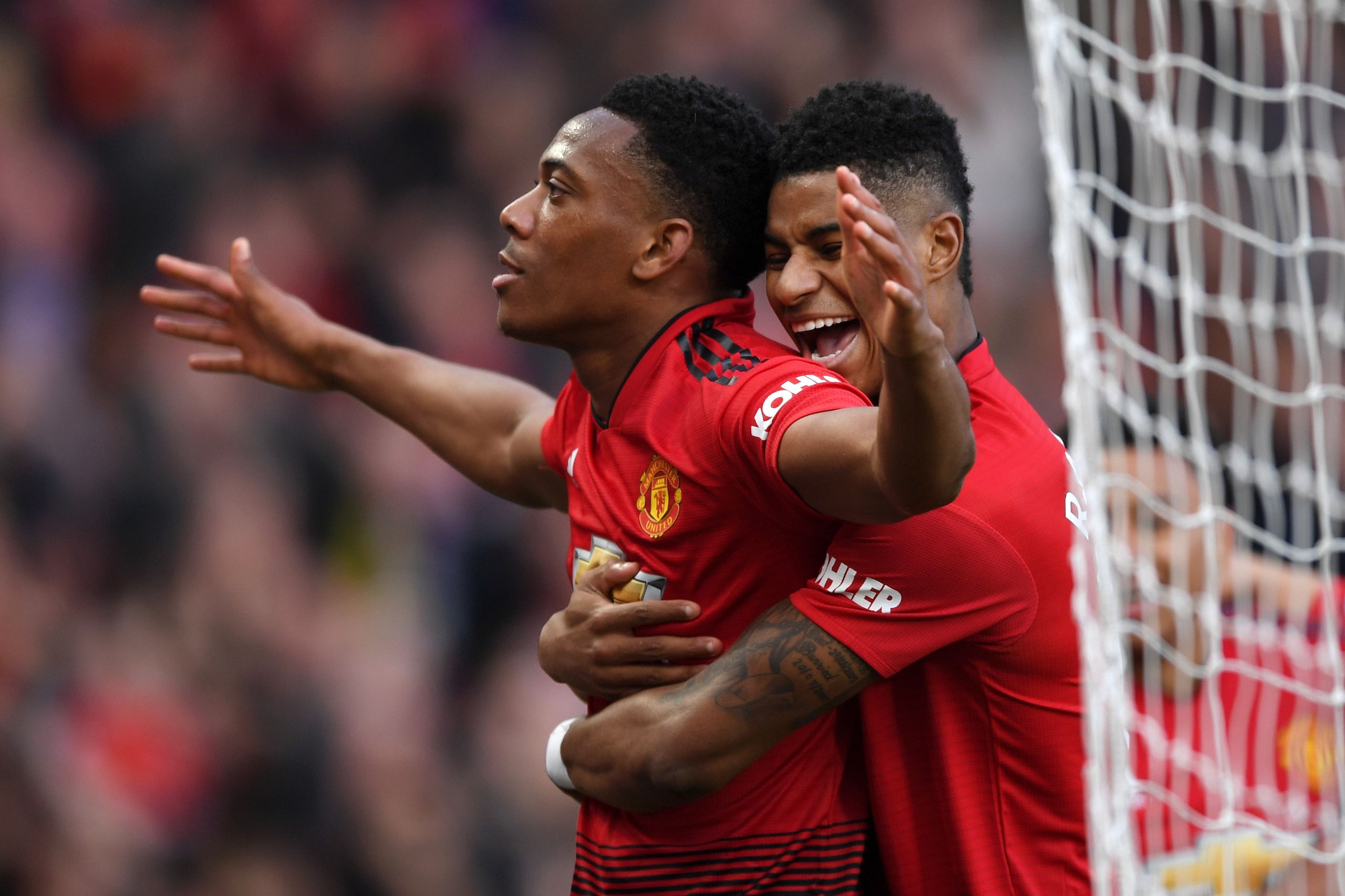 MANCHESTER, ENGLAND - MARCH 30: Anthony Martial of Manchester United celebrates with teammate Marcus Rashford after scoring his team's second goal during the Premier League match between Manchester United and Watford FC at Old Trafford on March 30, 2019 i