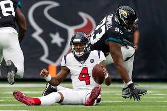 HOUSTON, TX - SEPTEMBER 15:  Deshaun Watson #4 of the Houston Texans reacts after a sack by Calais Campbell #93 of the Jacksonville Jaguars in the first half at NRG Stadium on September 15, 2019 in Houston, Texas.  (Photo by Tim Warner/Getty Images)