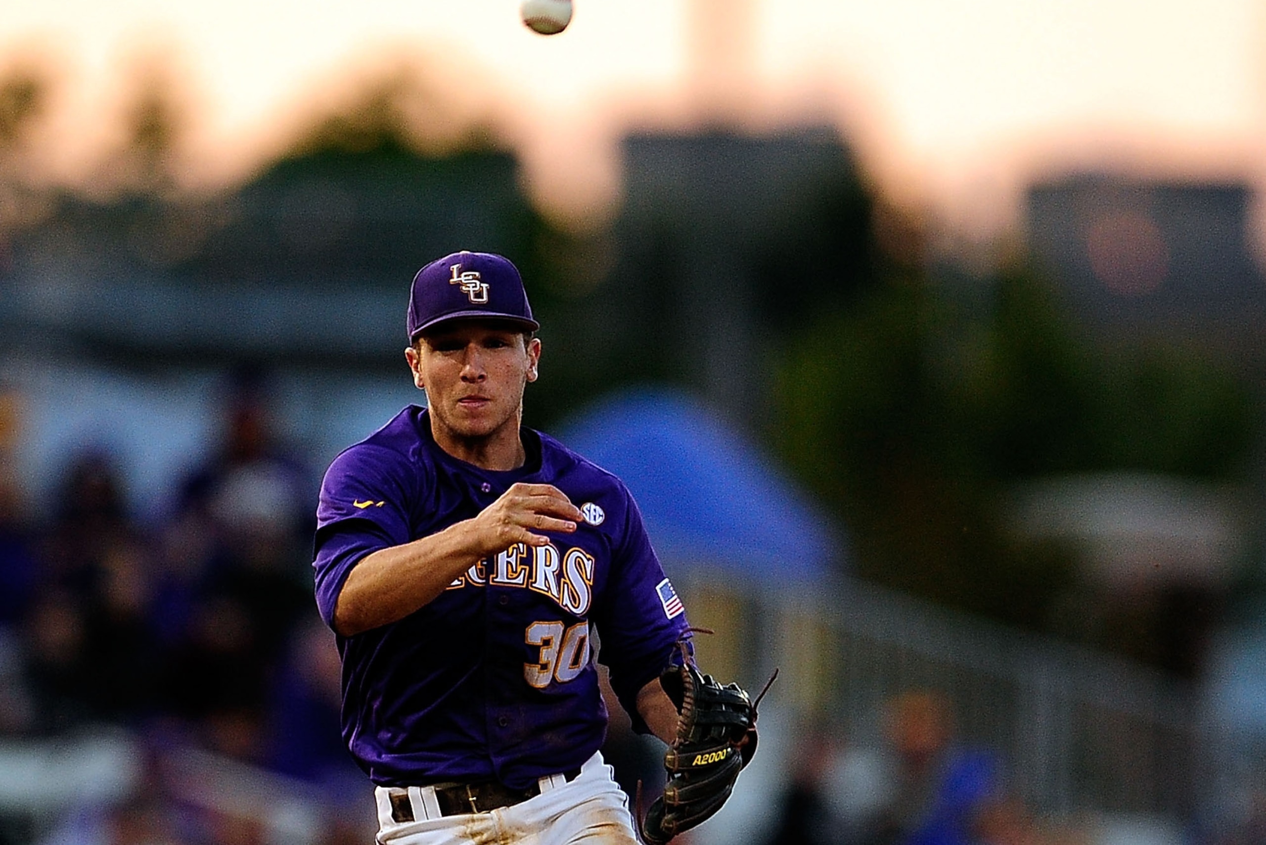 BATON ROUGE, LA - MAY 03:  Alex Bregman #30 of the LSU Tigers makes a throw to first base during a game against the Florida Gators at Alex Box Stadium on May 3, 2013 in Baton Rouge, Louisiana.  (Photo by Stacy Revere/Getty Images)
