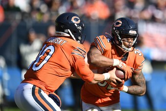 CHICAGO, ILLINOIS - OCTOBER 27:  David Montgomery #32 of the Chicago Bears takes a handoff from Mitchell Trubisky #10 during a game against the Los Angeles Chargers at Soldier Field on October 27, 2019 in Chicago, Illinois. The Chargers defeated the Bears