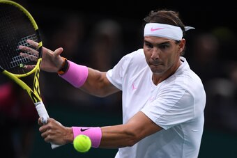 Spain's Rafael Nadal returns the ball to France's Adrian Mannarino during their men's singles tennis match on day three of the ATP World Tour Masters 1000 - Rolex Paris Masters - indoor tennis tournament at The AccorHotels Arena in Paris on October 30, 20