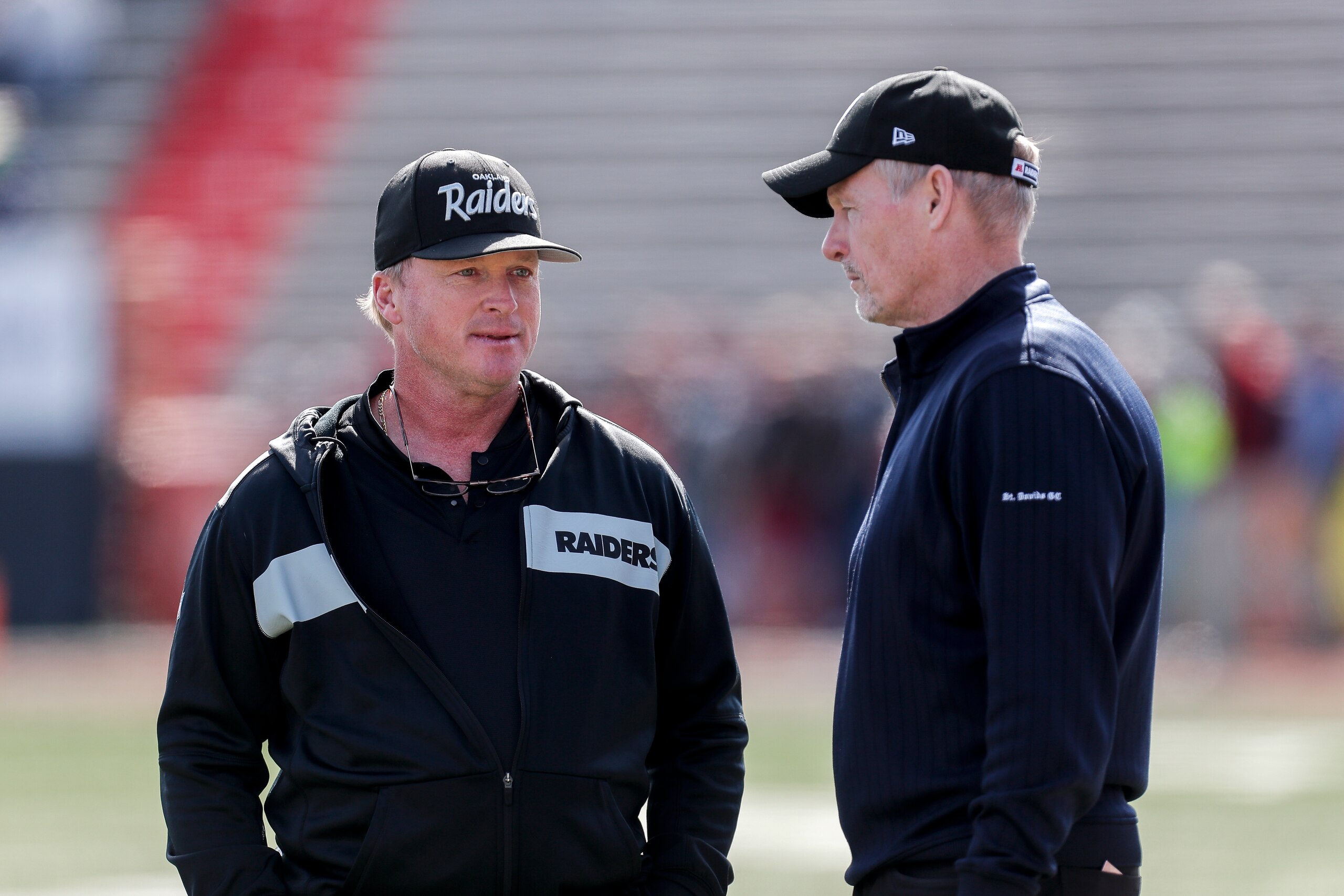 MOBILE, AL - JANUARY 26: Head Coach Jon Gruden and General Manager Mike Mayock of the Oakland Raiders of the North Team talk before the start of the 2019 Reese's Senior Bowl at Ladd-Peebles Stadium on January 26, 2019 in Mobile, Alabama. The North defeate