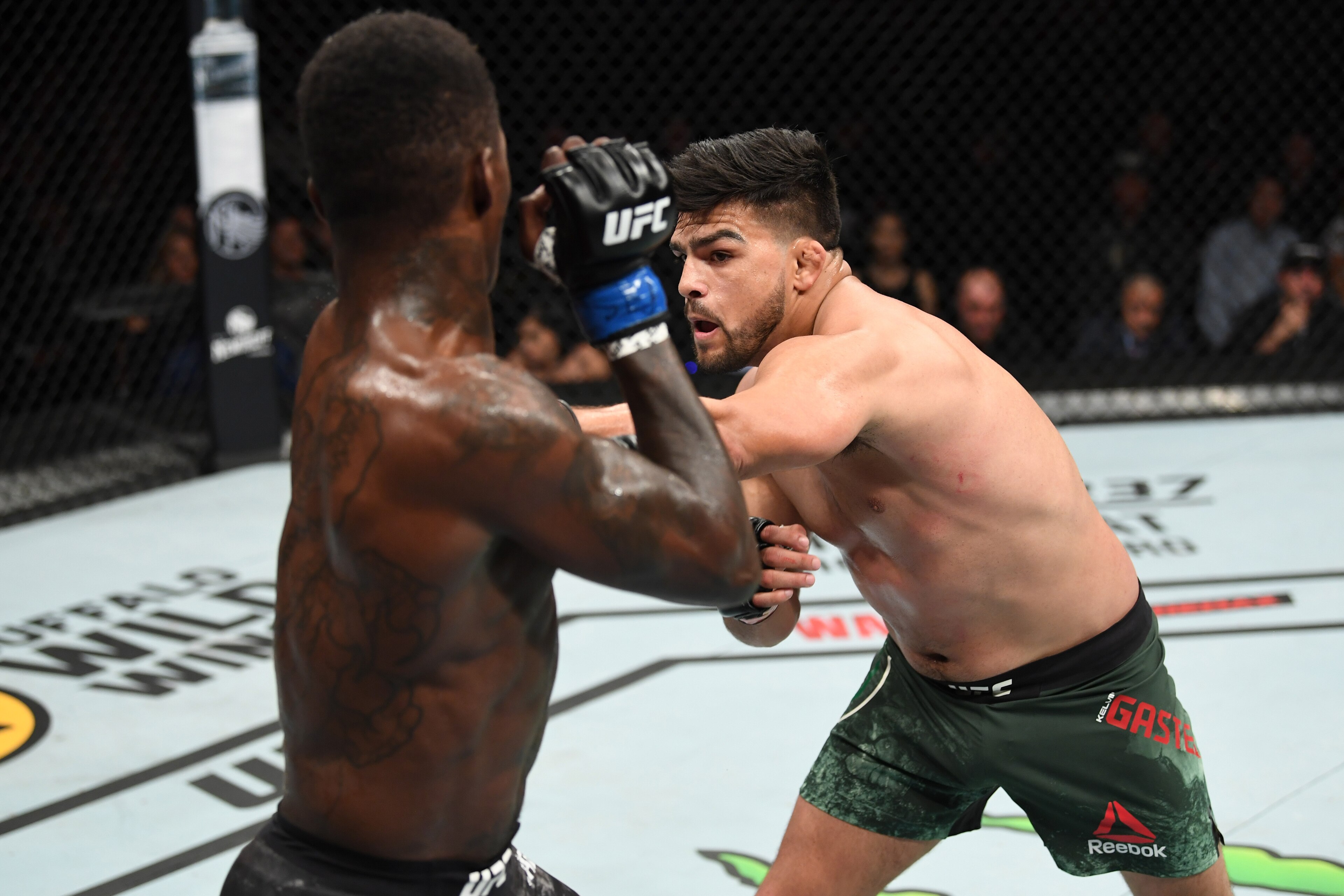 ATLANTA, GA - APRIL 13:  (R-L) Kelvin Gastelum punches Israel Adesanya in their interim middleweight championship bout during the UFC 236 event at State Farm Arena on April 13, 2019 in Atlanta, Georgia. (Photo by Josh Hedges/Zuffa LLC/Zuffa LLC via Getty 