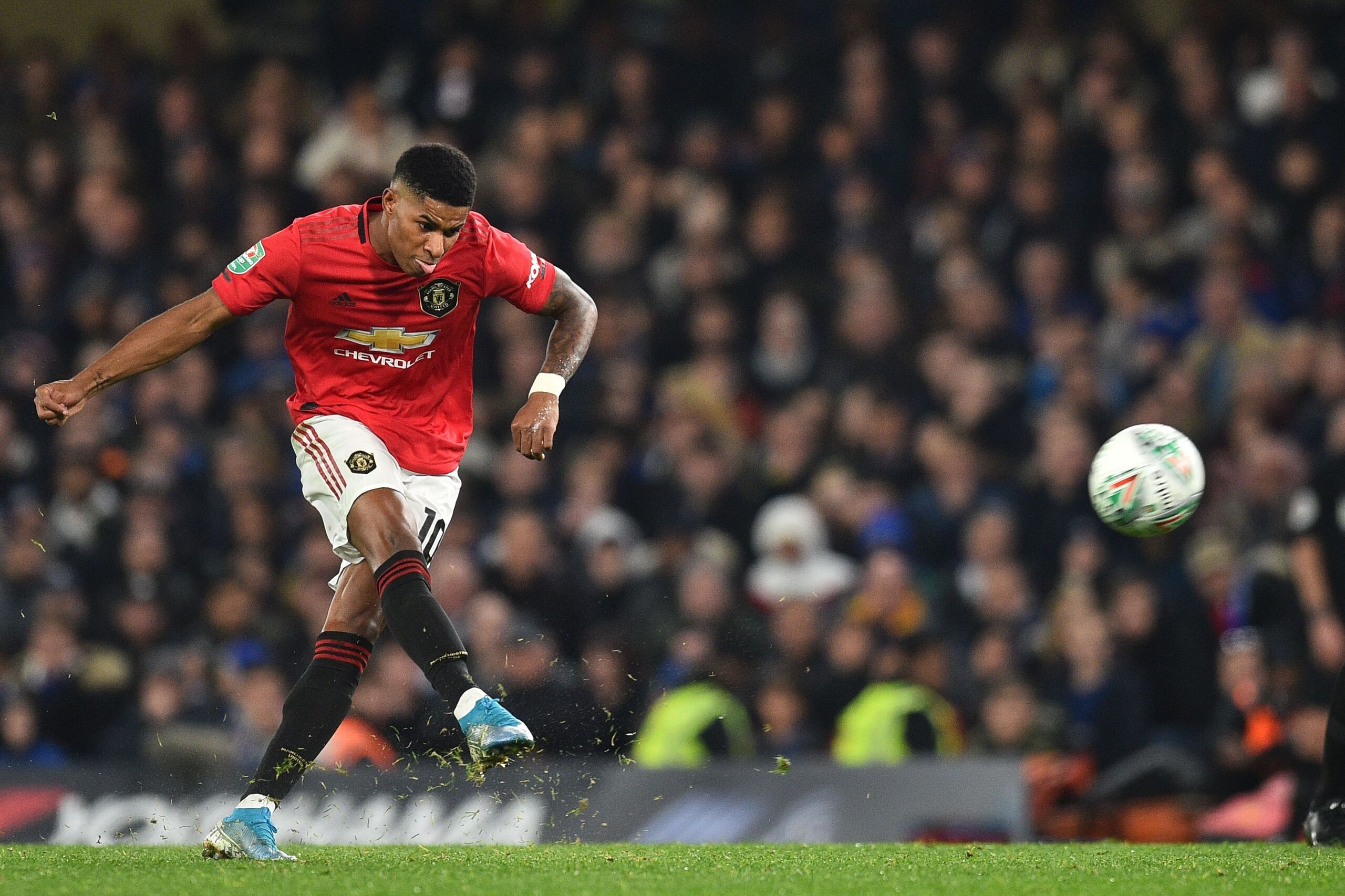 Manchester United's English striker Marcus Rashford takes a penalty and scores his team's second goal during the English League Cup fourth round football match between Chelsea and Manchester United at Stamford Bridge in London on October 30, 2019. (Photo 