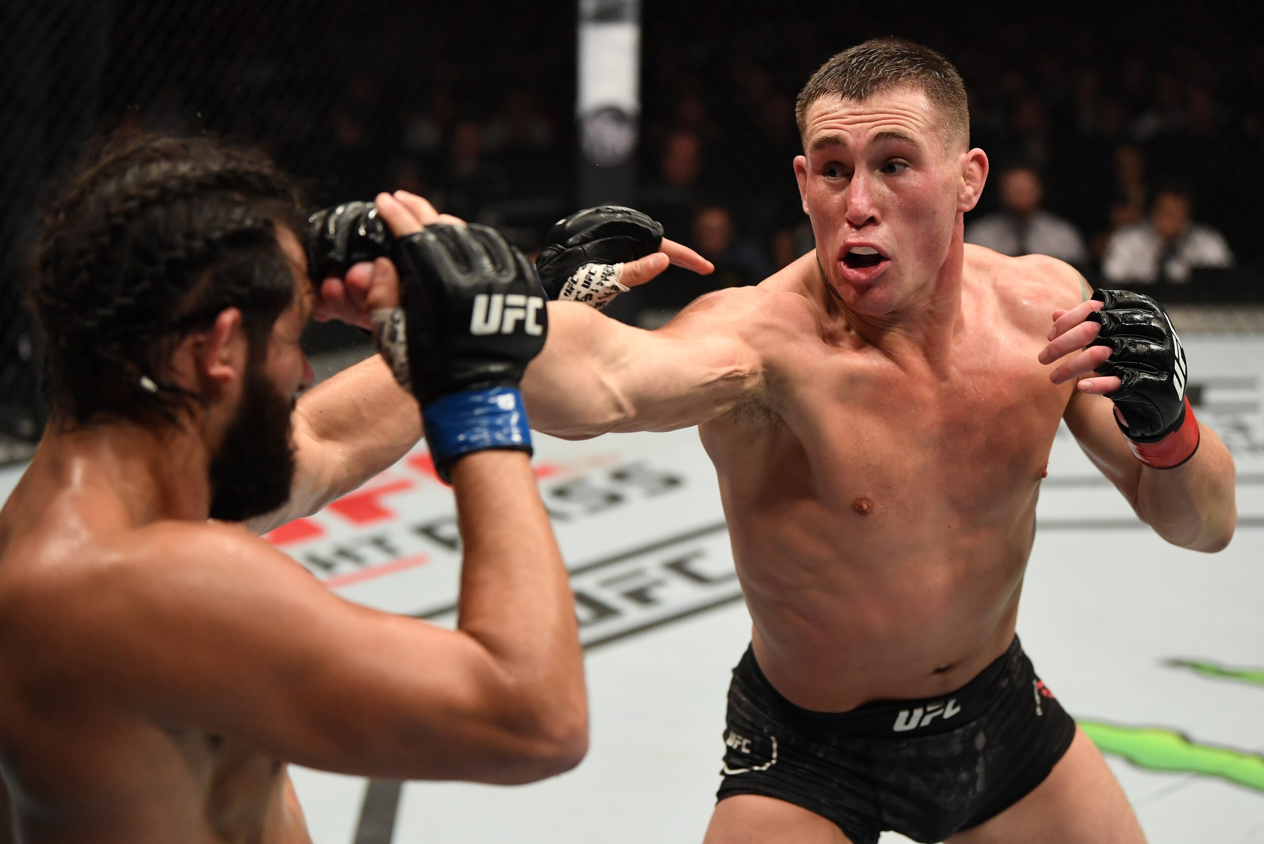 LONDON, ENGLAND - MARCH 16:  (R-L) Darren Till of England punches Jorge Masvidal in their welterweight bout during the UFC Fight Night event at The O2 Arena on March 16, 2019 in London, England. (Photo by Jeff Bottari/Zuffa LLC/Zuffa LLC via Getty Images)