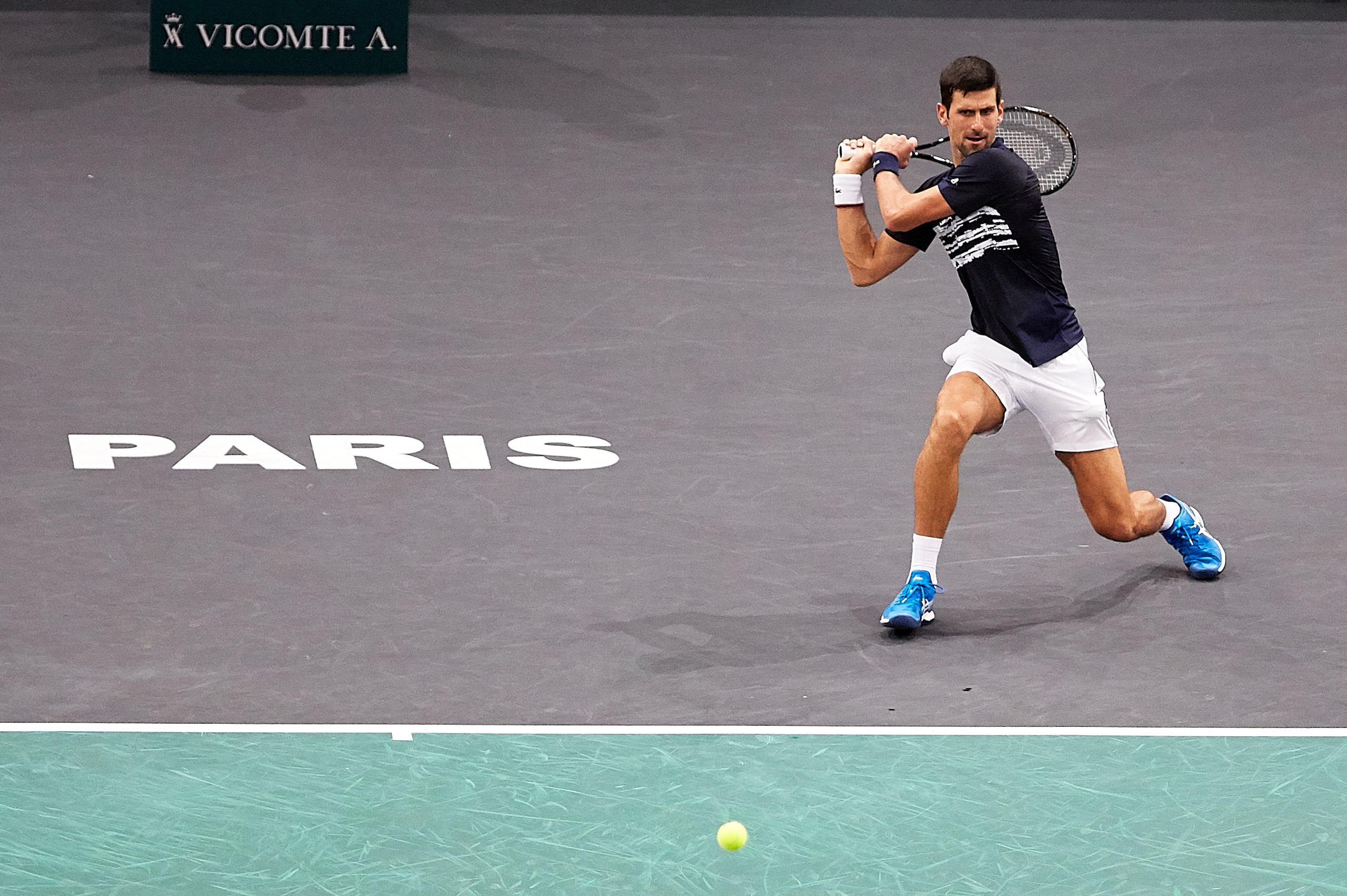 PARIS, FRANCE - NOVEMBER 01:  Novak Djokovic of Serbia returns the ball in his mens Quarterfinal match against Stefanos Tsitsipas of Greece during Day five of the Rolex Paris Masters at AccorHotels Arena on November 01, 2019 in Paris, France. (Photo by Qu