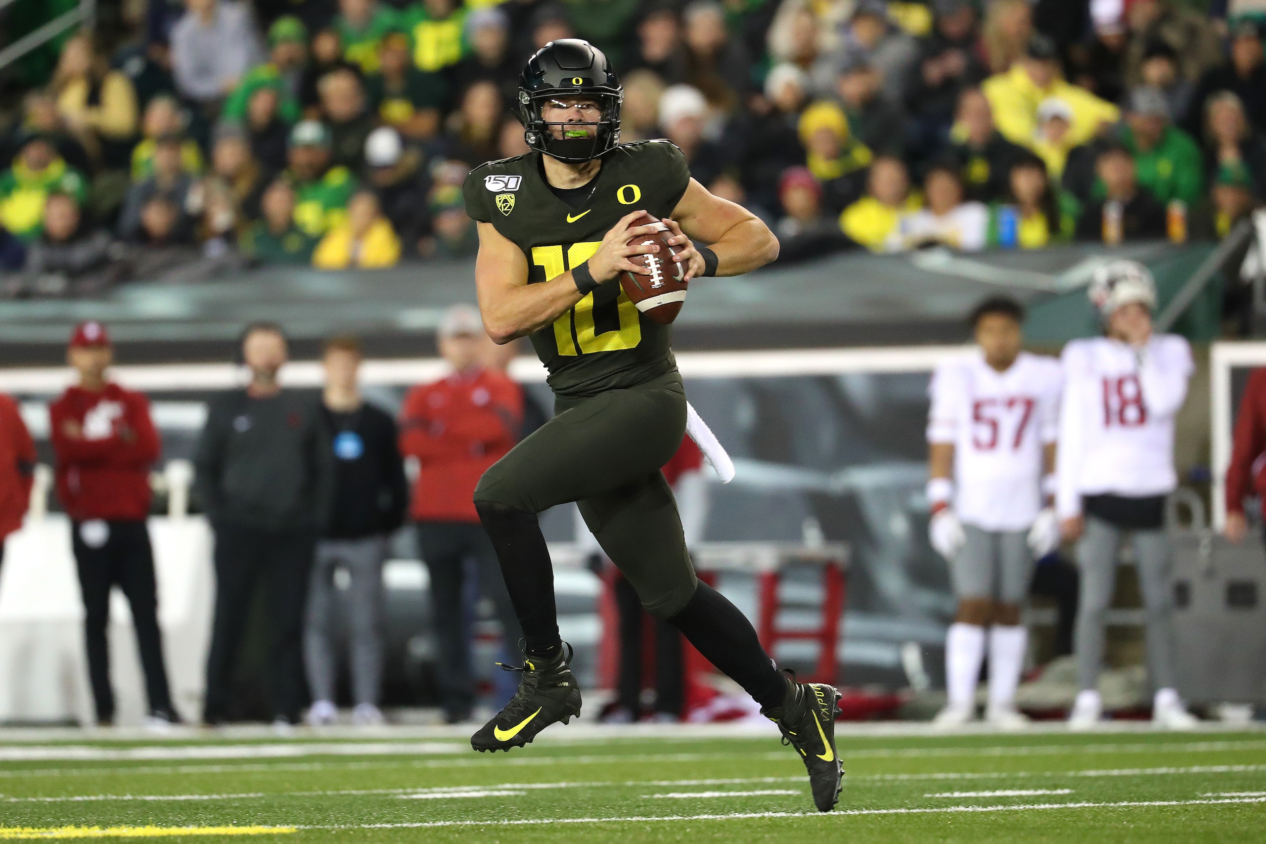 EUGENE, OREGON - OCTOBER 26: Justin Herbert #10 of the Oregon Ducks looks to throw the ball in the first quarter against the Washington State Cougars during their game at Autzen Stadium on October 26, 2019 in Eugene, Oregon. (Photo by Abbie Parr/Getty Ima
