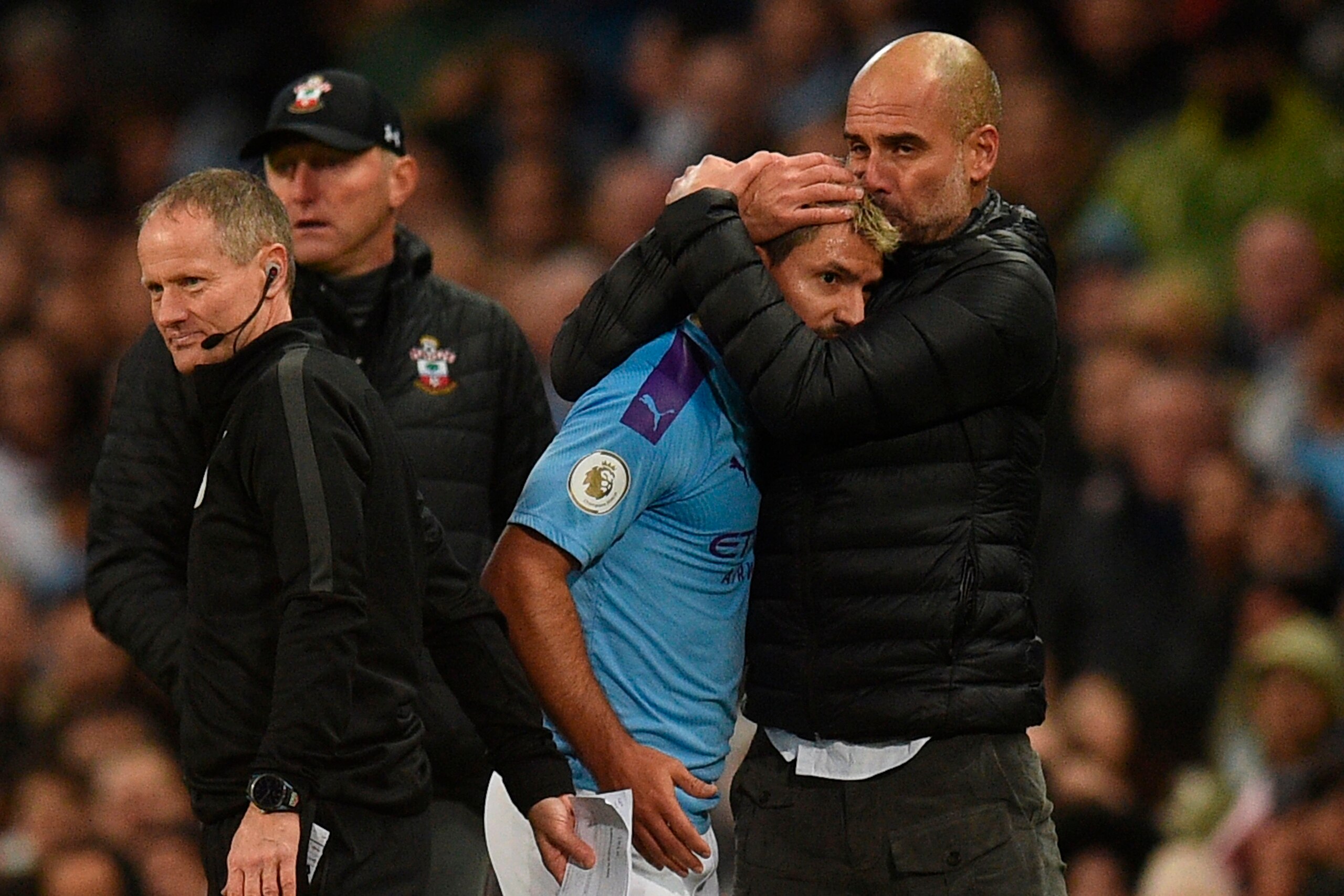Manchester City's Spanish manager Pep Guardiola (R) embraces Manchester City's Argentinian striker Sergio Aguero (C) on the touchline during the English Premier League football match between Manchester City and Southampton at the Etihad Stadium in Manches Manchester City's Spanish manager Pep Guardiola (R) embraces Manchester City's Argentinian striker Sergio Aguero (C) on the touchline during the English Premier League football match between Manchester City and Southampton at the Etihad Stadium in Manches
