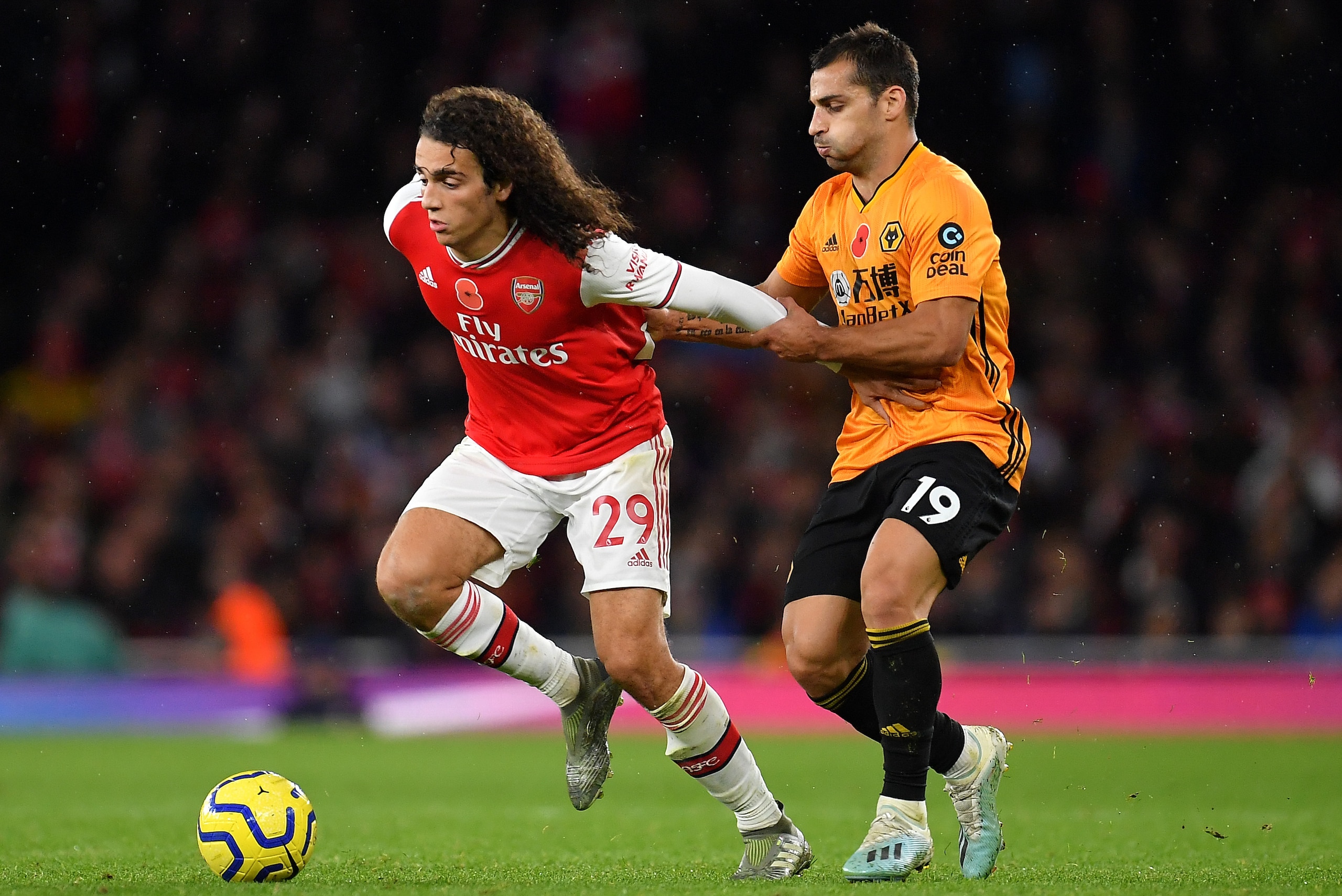 LONDON, ENGLAND - NOVEMBER 02: Jonny of Wolverhampton Wanderers tackles Matteo Guendouzi of Arsenal during the Premier League match between Arsenal FC and Wolverhampton Wanderers at Emirates Stadium on November 02, 2019 in London, United Kingdom. (Photo b LONDON, ENGLAND - NOVEMBER 02: Jonny of Wolverhampton Wanderers tackles Matteo Guendouzi of Arsenal during the Premier League match between Arsenal FC and Wolverhampton Wanderers at Emirates Stadium on November 02, 2019 in London, United Kingdom. (Photo b