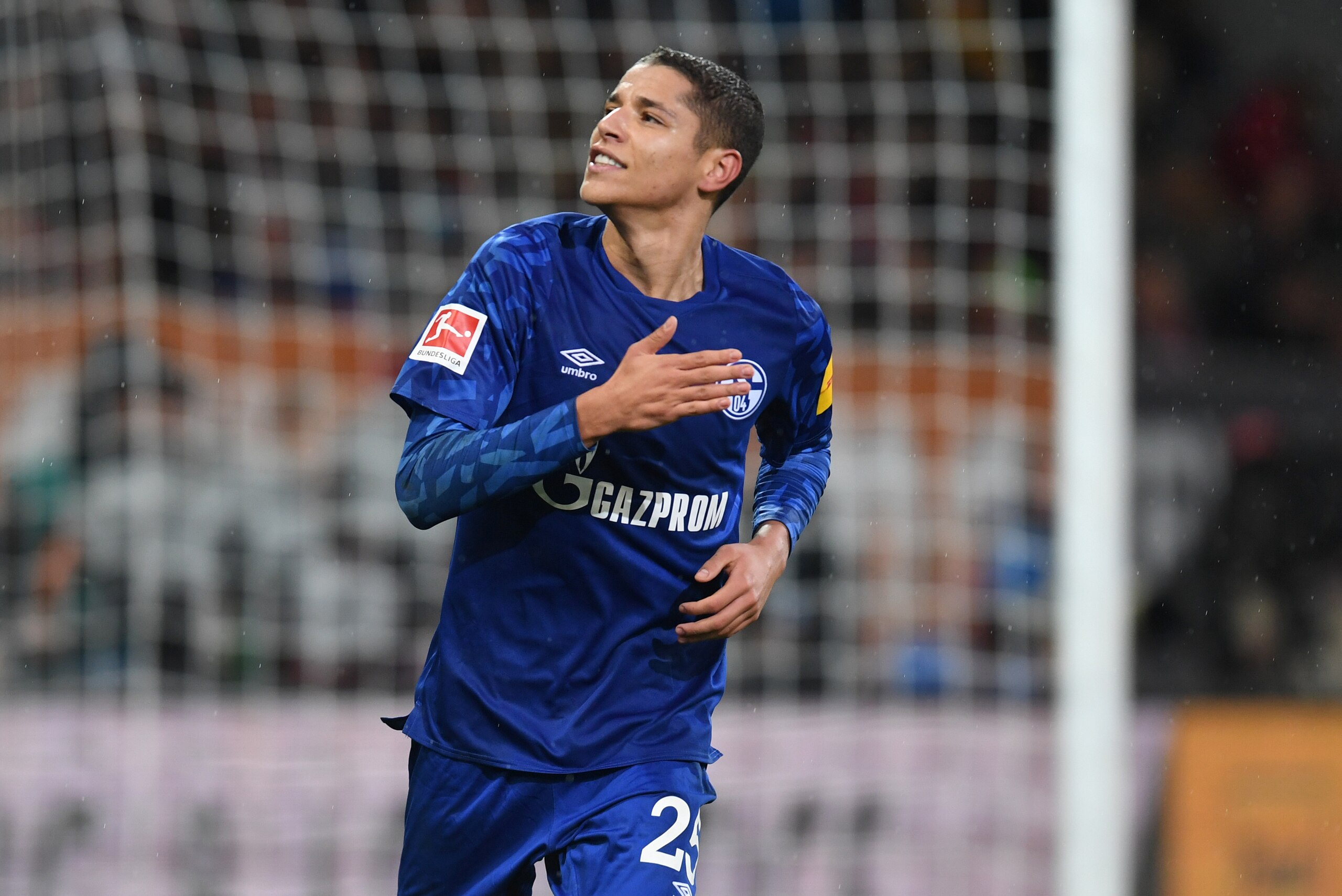 Schalke's French midfielder Amine Harit reacts after scoring during the German first division Bundesliga football match between FC Augsburg and FC Schalke 04 on November 3, 2019 in Augsburg, southern Germany. (Photo by Christof STACHE / AFP) / DFL REGULAT