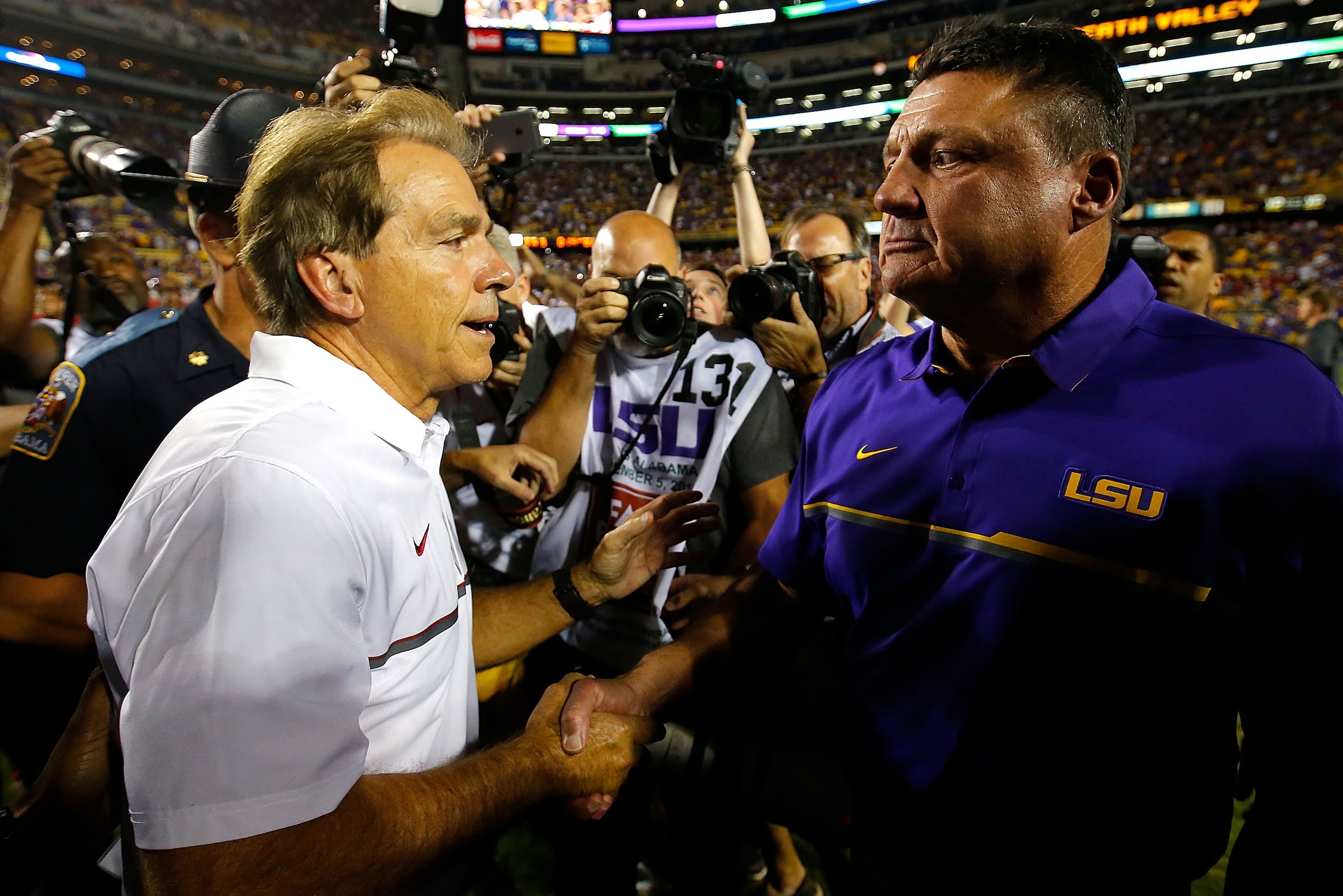 BATON ROUGE, LA - NOVEMBER 05: Head coach Nick Saban of the Alabama Crimson Tide shakes hands with head coach Ed Orgeron of the LSU Tigers after their 10-0 win at Tiger Stadium on November 5, 2016 in Baton Rouge, Louisiana. (Photo by Kevin C. Cox/Getty BATON ROUGE, LA - NOVEMBER 05: Head coach Nick Saban of the Alabama Crimson Tide shakes hands with head coach Ed Orgeron of the LSU Tigers after their 10-0 win at Tiger Stadium on November 5, 2016 in Baton Rouge, Louisiana. (Photo by Kevin C. Cox/Getty
