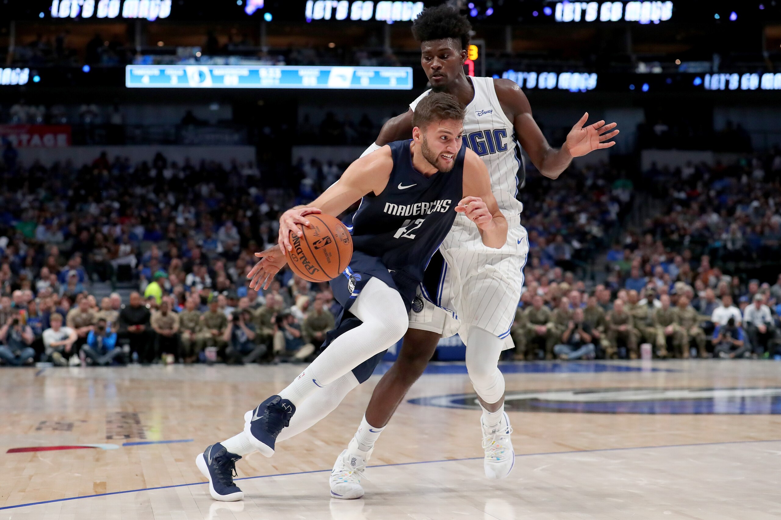 DALLAS, TEXAS - NOVEMBER 06: Maxi Kleber #42 of the Dallas Mavericks drives to the basket against Jonathan Isaac #1 of the Orlando Magic in the second half at American Airlines Center on November 06, 2019 in Dallas, Texas. NOTE TO USER: User expressly ack