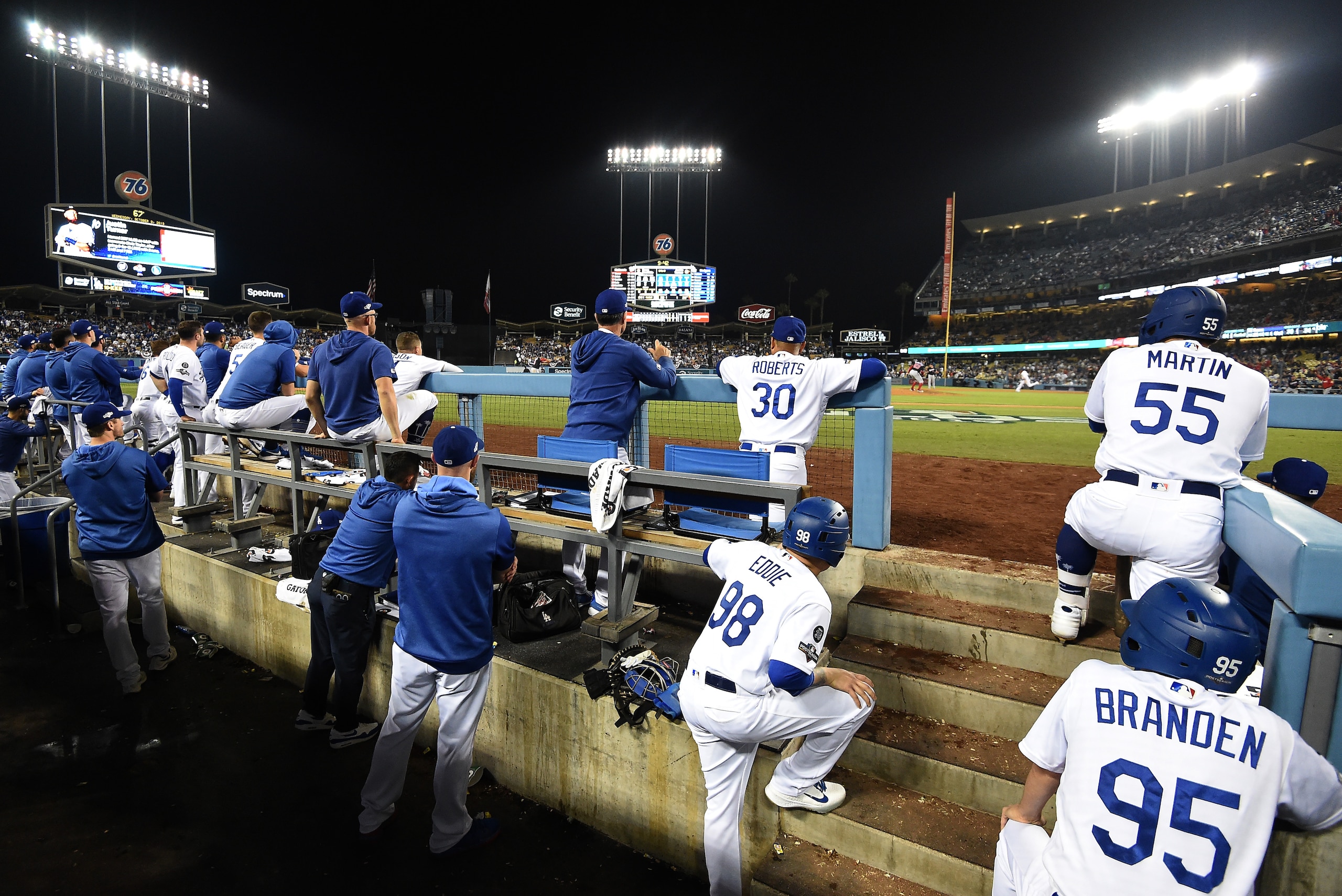 LOS ANGELES, CALIFORNIA - OCTOBER 09: The Los Angeles Dodgers look on from the dug out during the tenth inning en route to losing to the Washington Nationals 7-3 in game five and the National League Division Series at Dodger Stadium on October 09, 2019 in