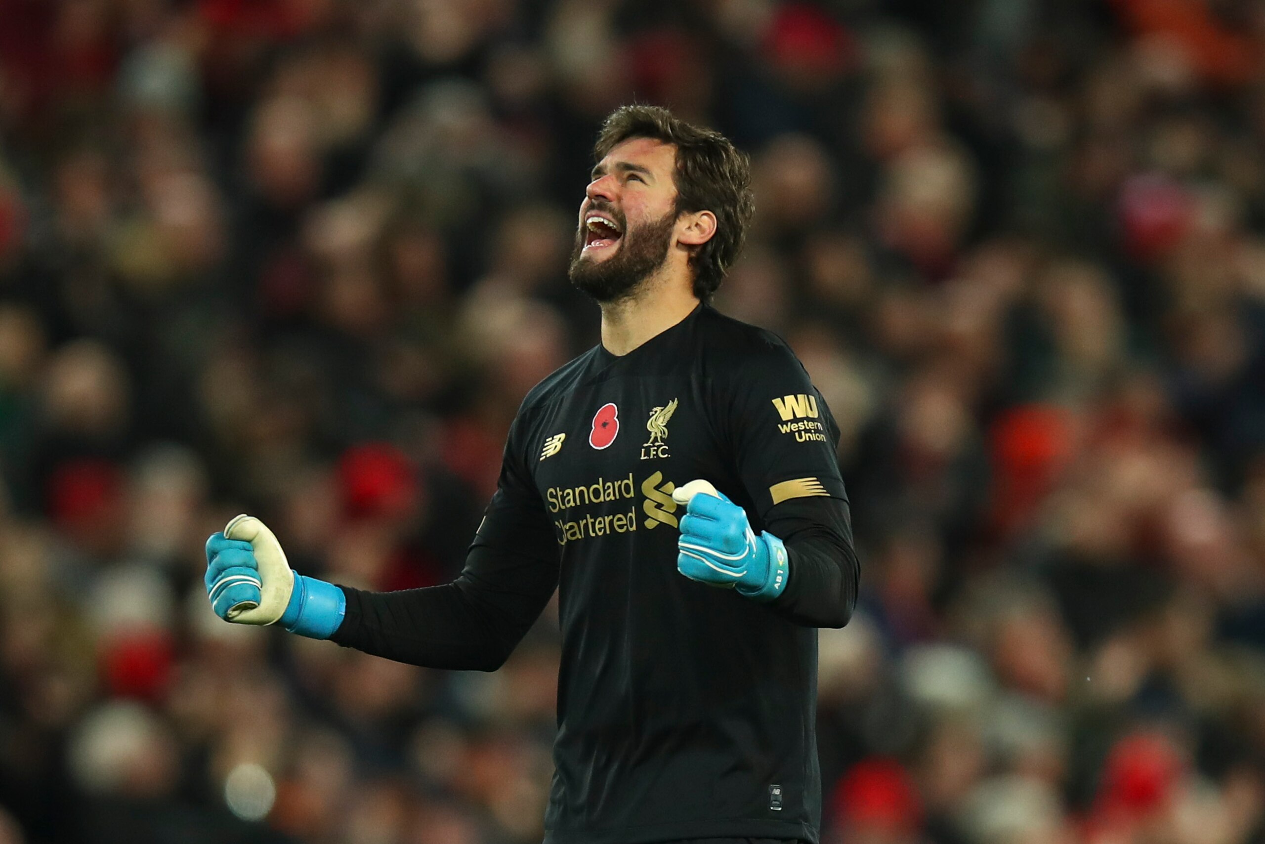 LIVERPOOL, ENGLAND - NOVEMBER 10: Alisson Becker of Liverpool celebrates after Sadio Mane of Liverpool scored a goal to make it 3-0 during the Premier League match between Liverpool FC and Manchester City at Anfield on November 10, 2019 in Liverpool, Unit