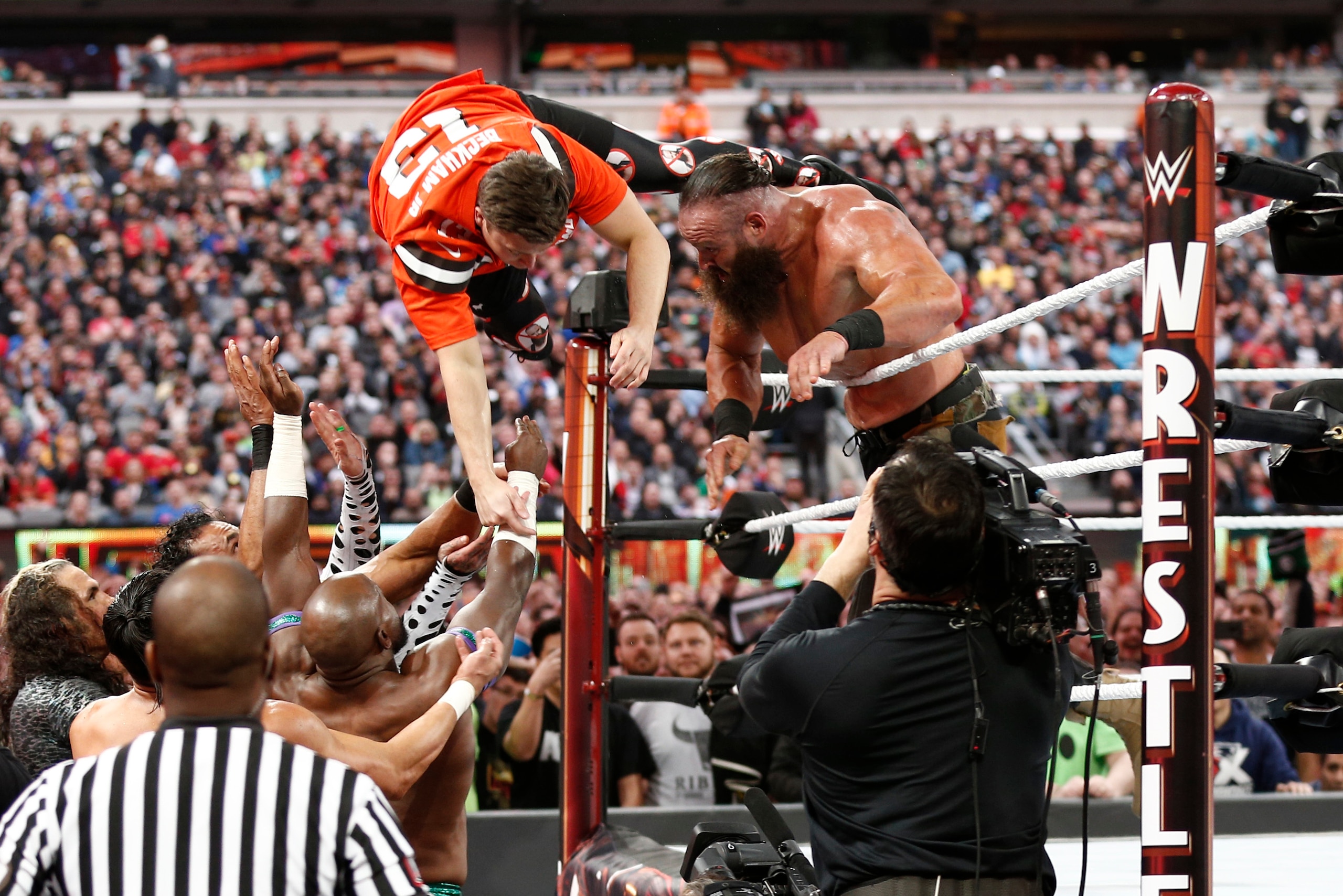 EAST RUTHERFORD, NEW JERSEY - APRIL 07: Braun Strowman tosses Colin Jost out of the ring during SNL's Michael Che and Colin Jost at WWE WrestleMania at Met Life Stadium on April 07, 2019 in East Rutherford, New Jersey. (Photo by Brian Ach/Getty Images for