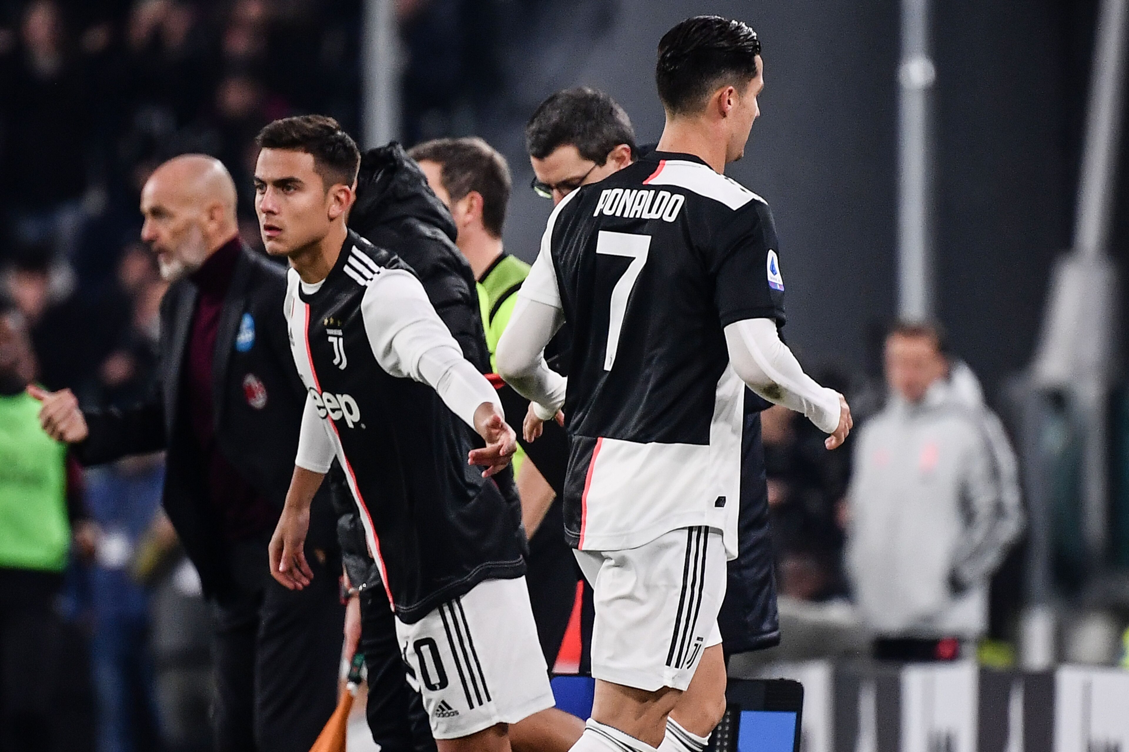 Juventus' Portuguese forward Cristiano Ronaldo (R) leaves the pitch after being substituted by Juventus' Argentine forward Paulo Dybala (L) during the Italian Serie A football match Juventus vs AC Milan on November 10, 2019 at the Juventus Allianz stadium