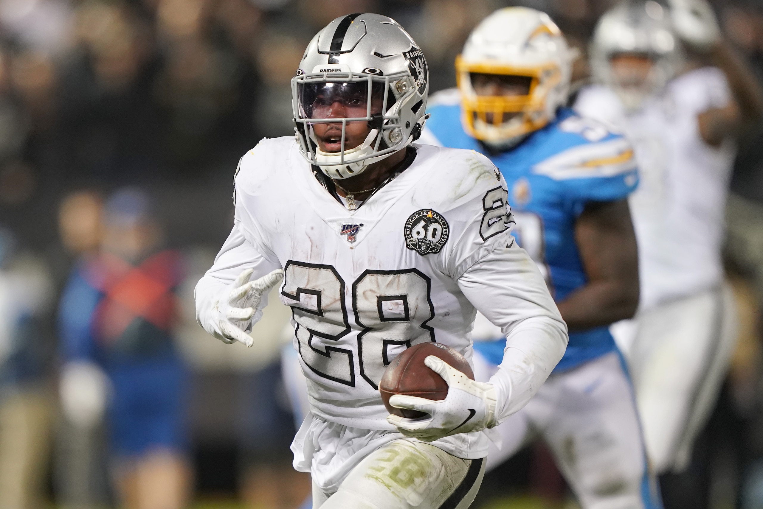 OAKLAND, CALIFORNIA - NOVEMBER 07: Josh Jacobs #28 of the Oakland Raiders breaks free to score on an 18 yard touchdown run late in the fourth quarter against the Los Angeles Chargers at RingCentral Coliseum on November 07, 2019 in Oakland, California. The