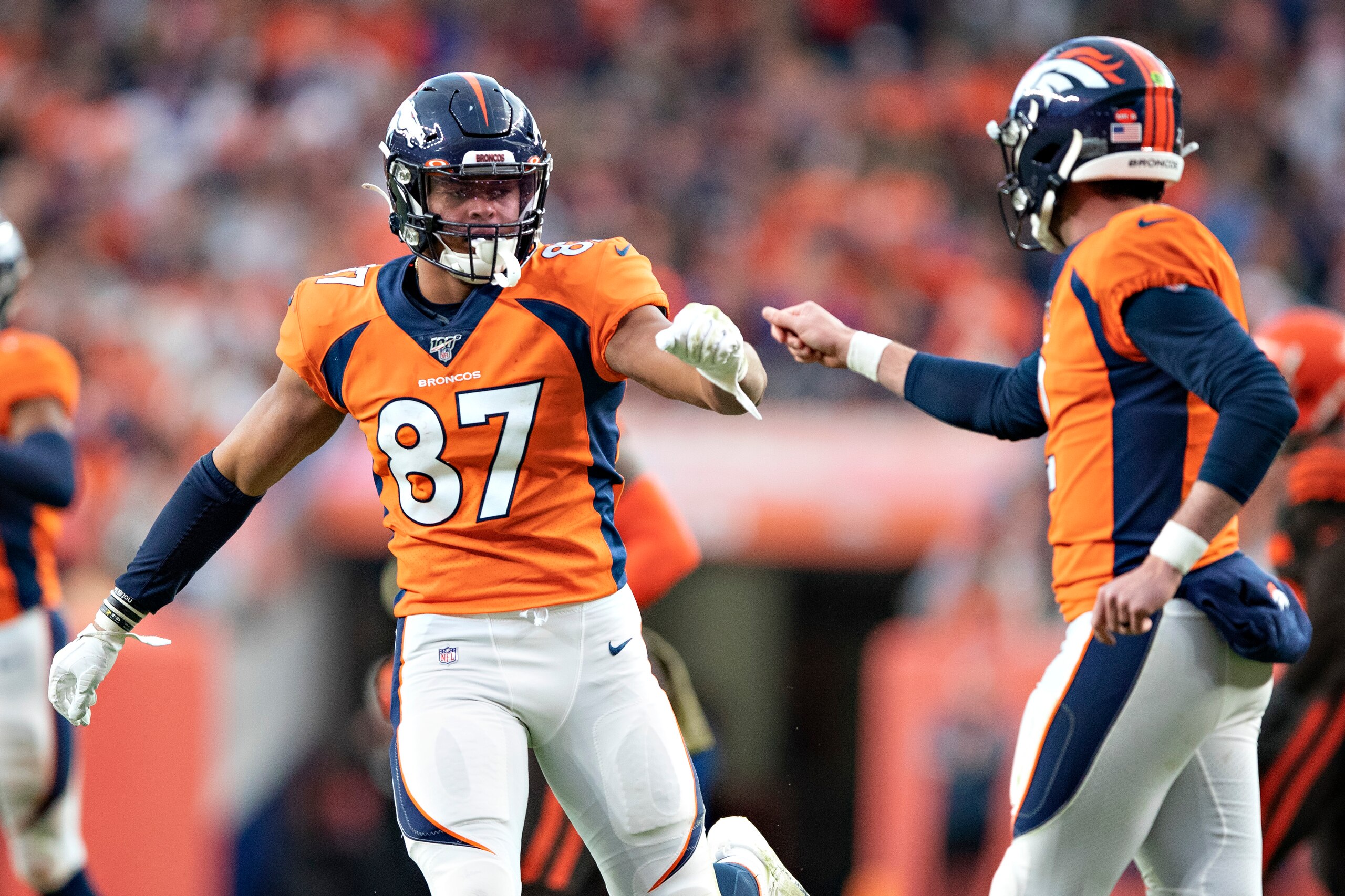 DENVER, CO - NOVEMBER 3:  Brandon Allen #2 is congratulated by Noah Fans #87 of the Denver Broncos after a touchdown during the second half of a game against the Cleveland Browns at Broncos Stadium at Mile High on November 3, 2019 in Denver, Colorado.  Th