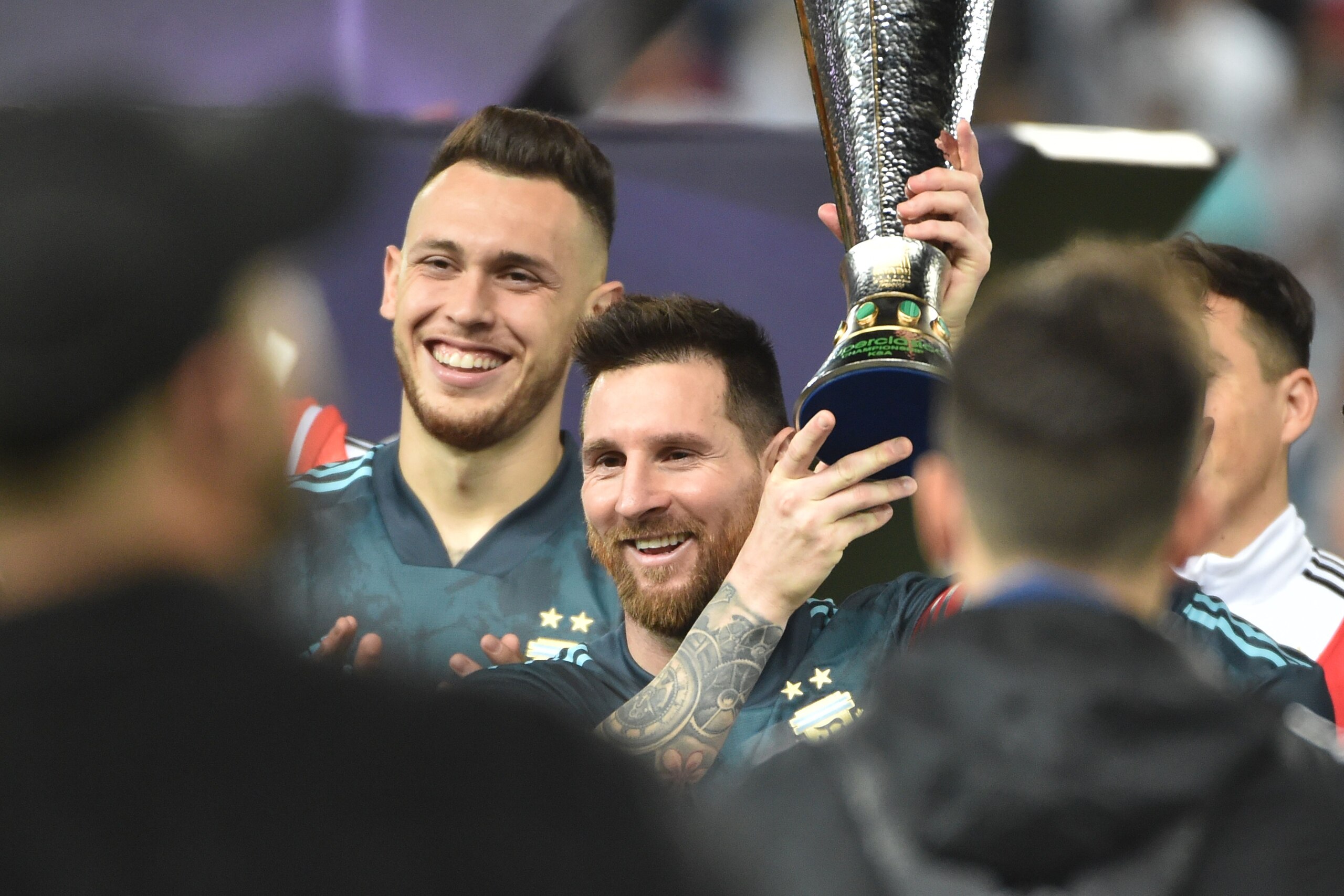 Argentina's forward Lionel Messi is presented with a cup after their win during the friendly football match between Brazil and Argentina at the King Saud University stadium in the Saudi capital Riyadh on November 15, 2019. (Photo by Fayez Nureldine / AFP)