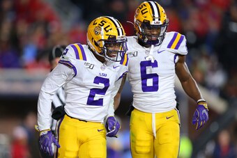 OXFORD, MISSISSIPPI - NOVEMBER 16: Justin Jefferson #2 of the LSU Tigers celebrates a touchdown with Terrace Marshall Jr. #6 during the second half of a game against the Mississippi Rebels at Vaught-Hemingway Stadium on November 16, 2019 in Oxford, Missis