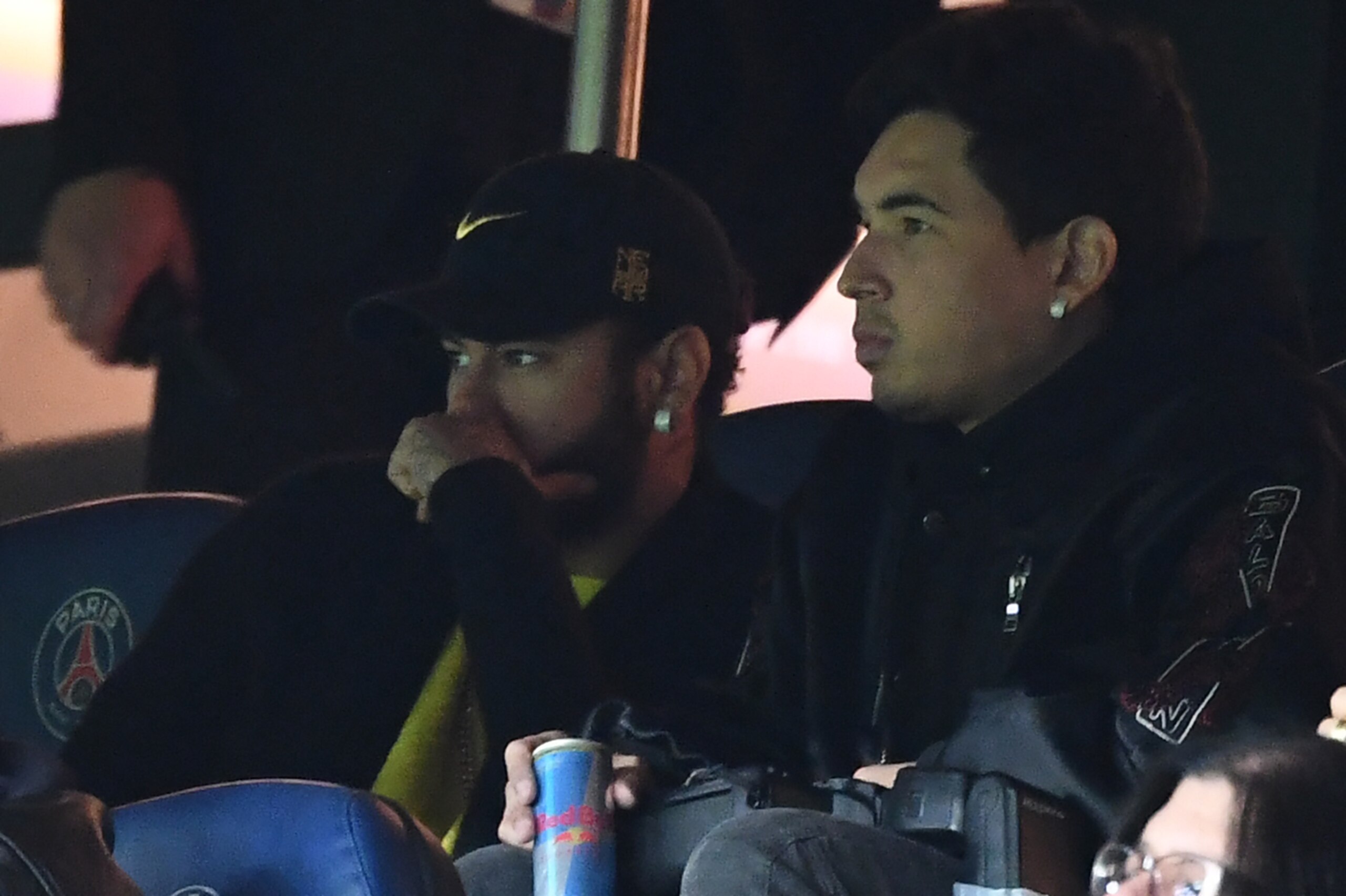 PSG's Brazilian forward Neymar (L) watches the UEFA Champions League Group A football match between Paris Saint-Germain (PSG) and Club Brugge from the stand at the Parc des Princes stadium in Paris on November 6, 2019. (Photo by FRANCK FIFE / AFP) (Photo 