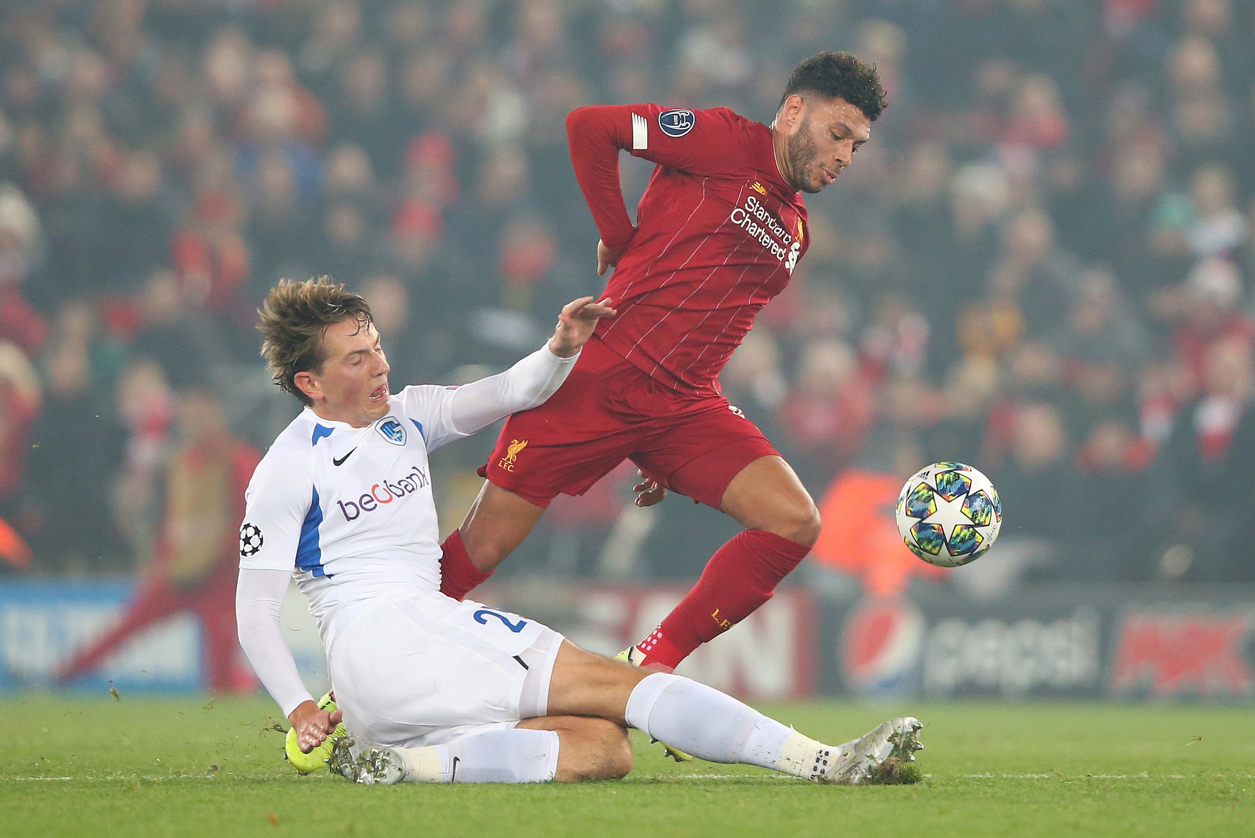 LIVERPOOL, ENGLAND - NOVEMBER 05:  Alex Oxlade-Chamberlain of Liverpool is tackled by Sander Berge of KRC Genk during the UEFA Champions League group E match between Liverpool FC and KRC Genk at Anfield on November 05, 2019 in Liverpool, United Kingdom. (
